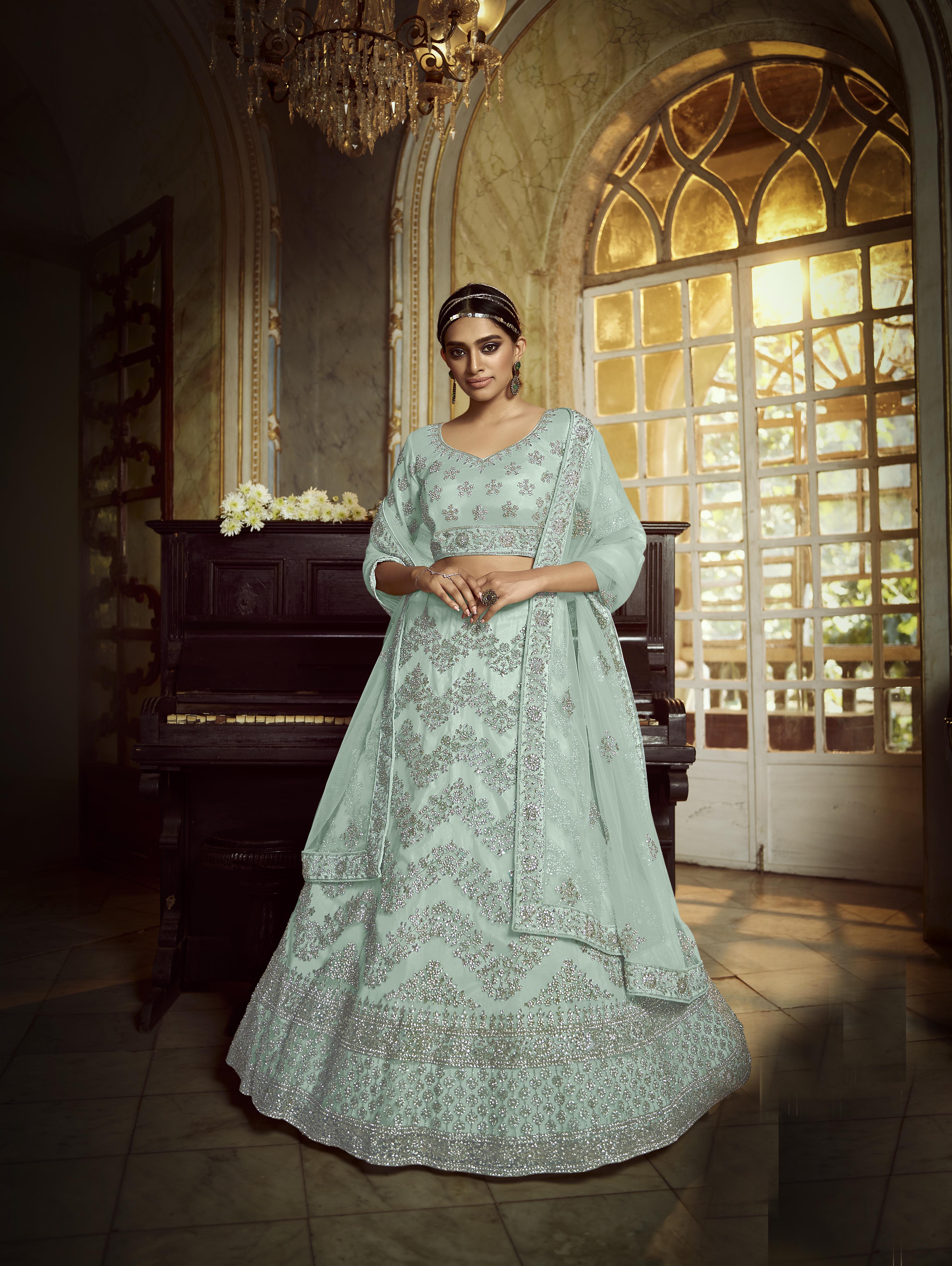 Pastel Turquoise Zarkan Embroidered Semi Stitched Net Lehenga-Choli with Stone Detailing - FunkyTradition