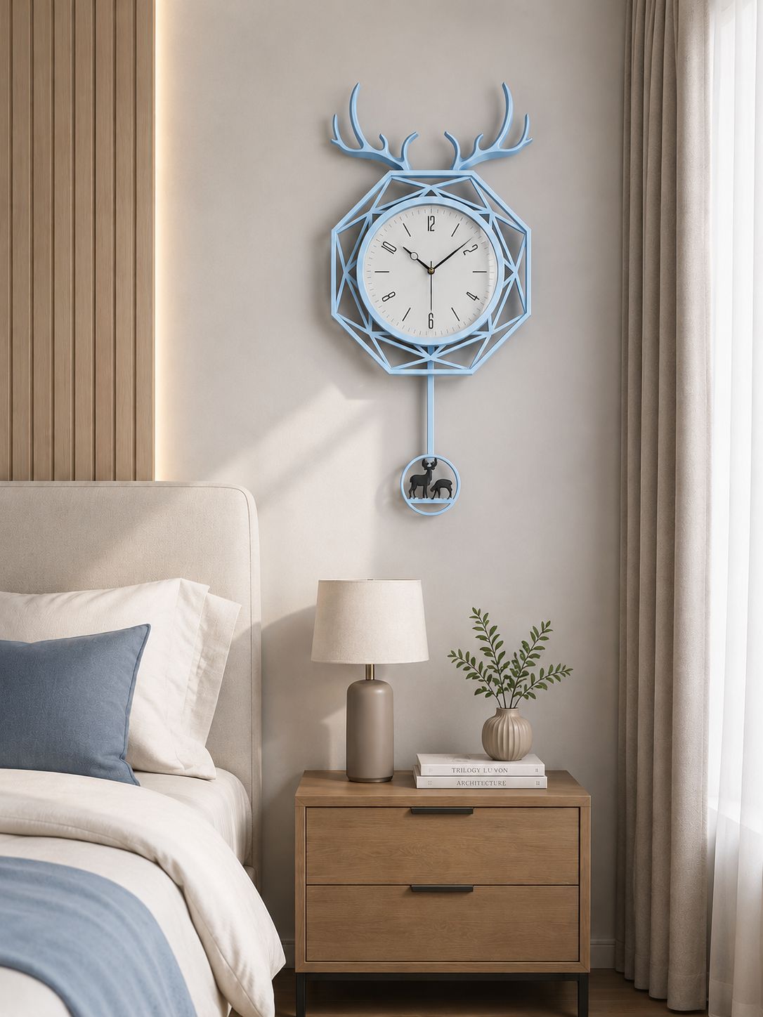 A light blue geometric wall clock with antler details hangs above a wooden nightstand in a modern bedroom setting.