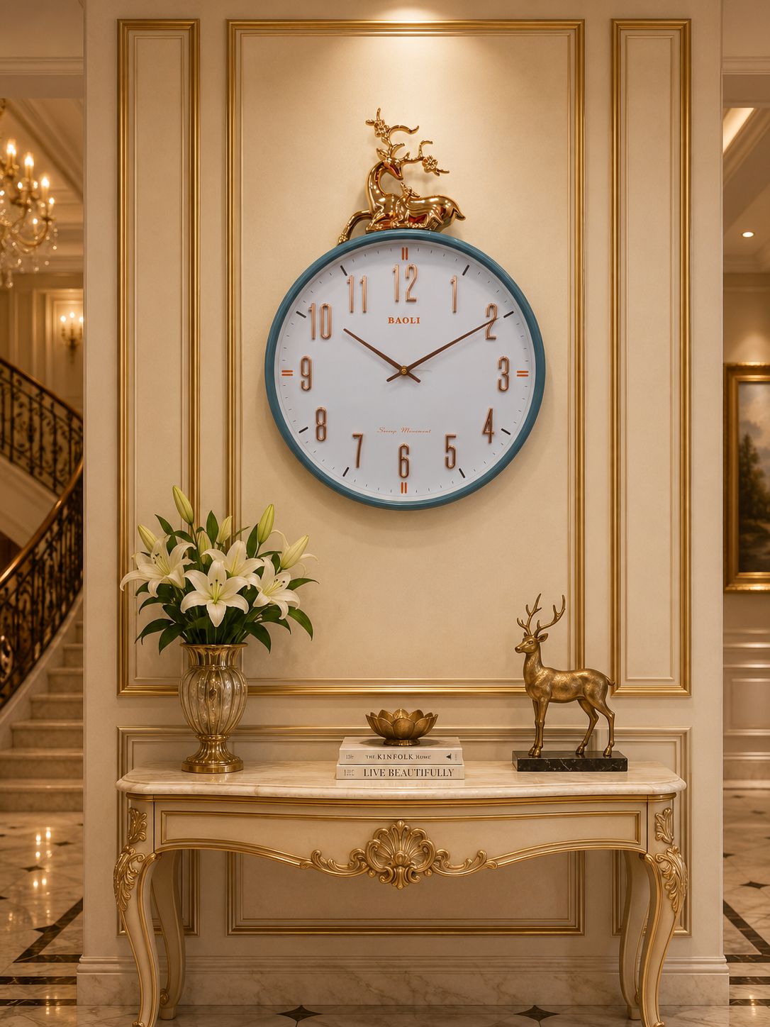 A round wall clock with a blue rim and gold decorative horse-and-rider sculpture above it, mounted on a cream paneled wall above a console table with flowers and a deer statue.