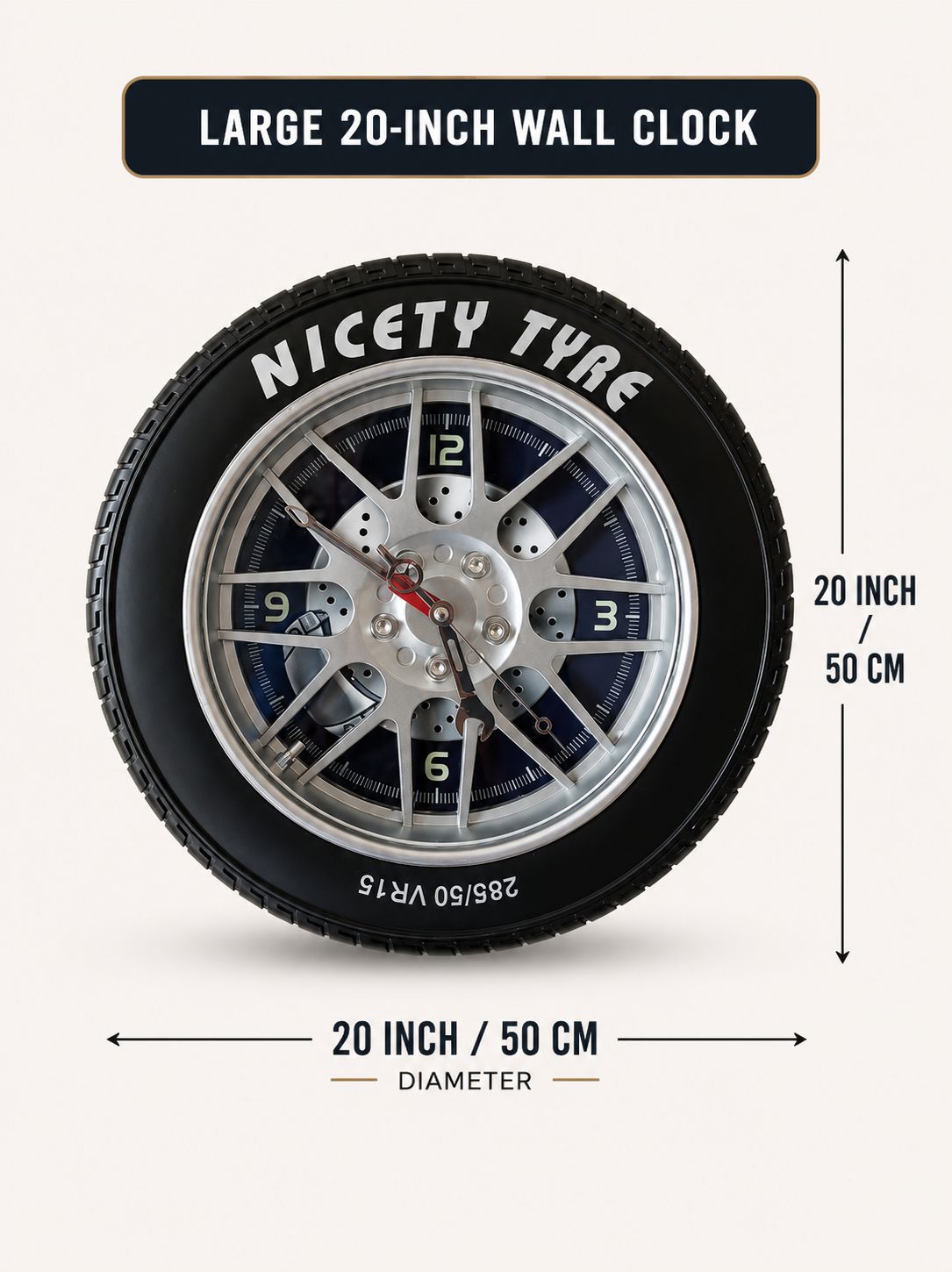 A tire-shaped wall clock labeled 'NICETY TYRE' shown with dimension arrows and text indicating a 20-inch / 50 cm diameter and 20-inch height. The clock face is black with silver wheel spokes, white numerals, and a red second hand on a light beige background.