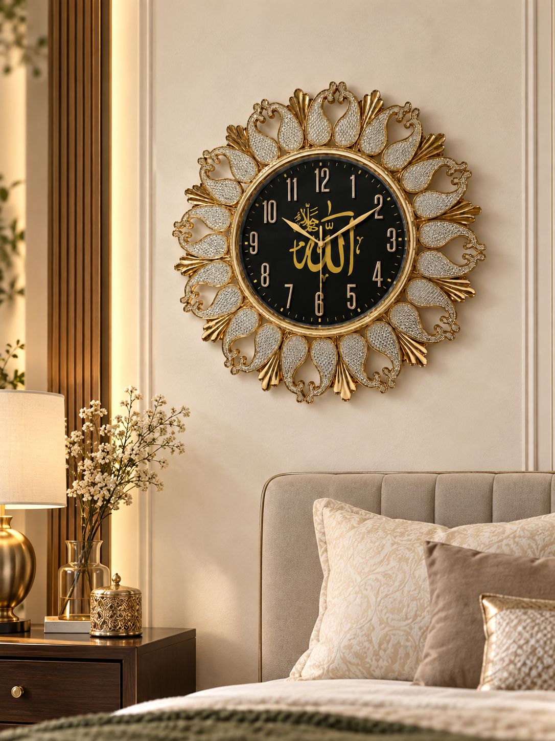 An ornate round wall clock with a gold sunburst frame and black face featuring gold Arabic calligraphy, mounted on a beige wall above a bed in a styled bedroom.