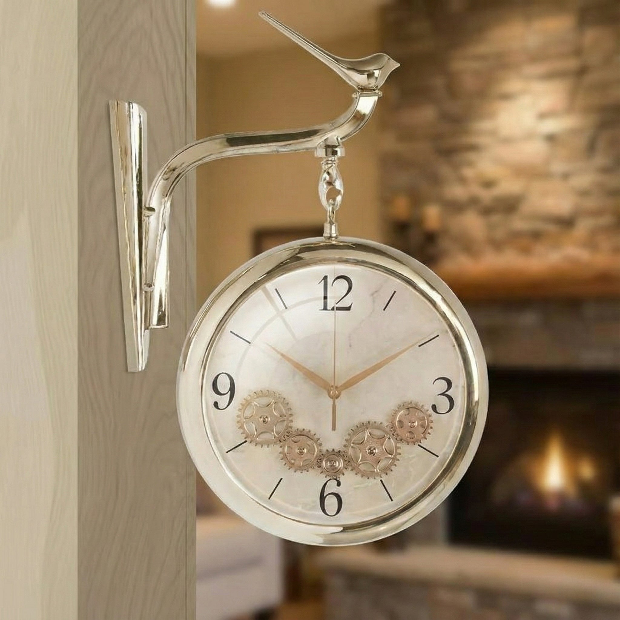 Antique cream double sided wall clock with bird design hanging on wall.