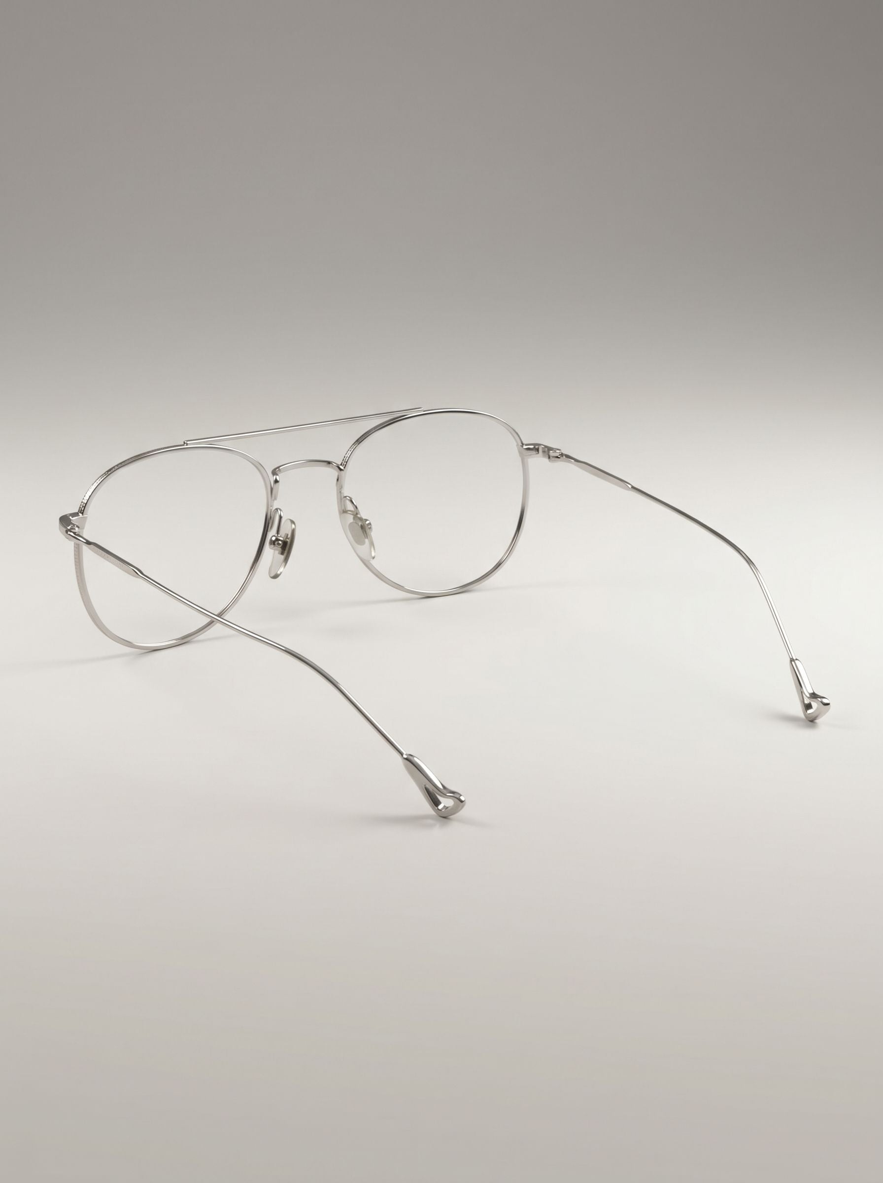 Back profile shot of lightweight silver stainless steel eyeglasses frame