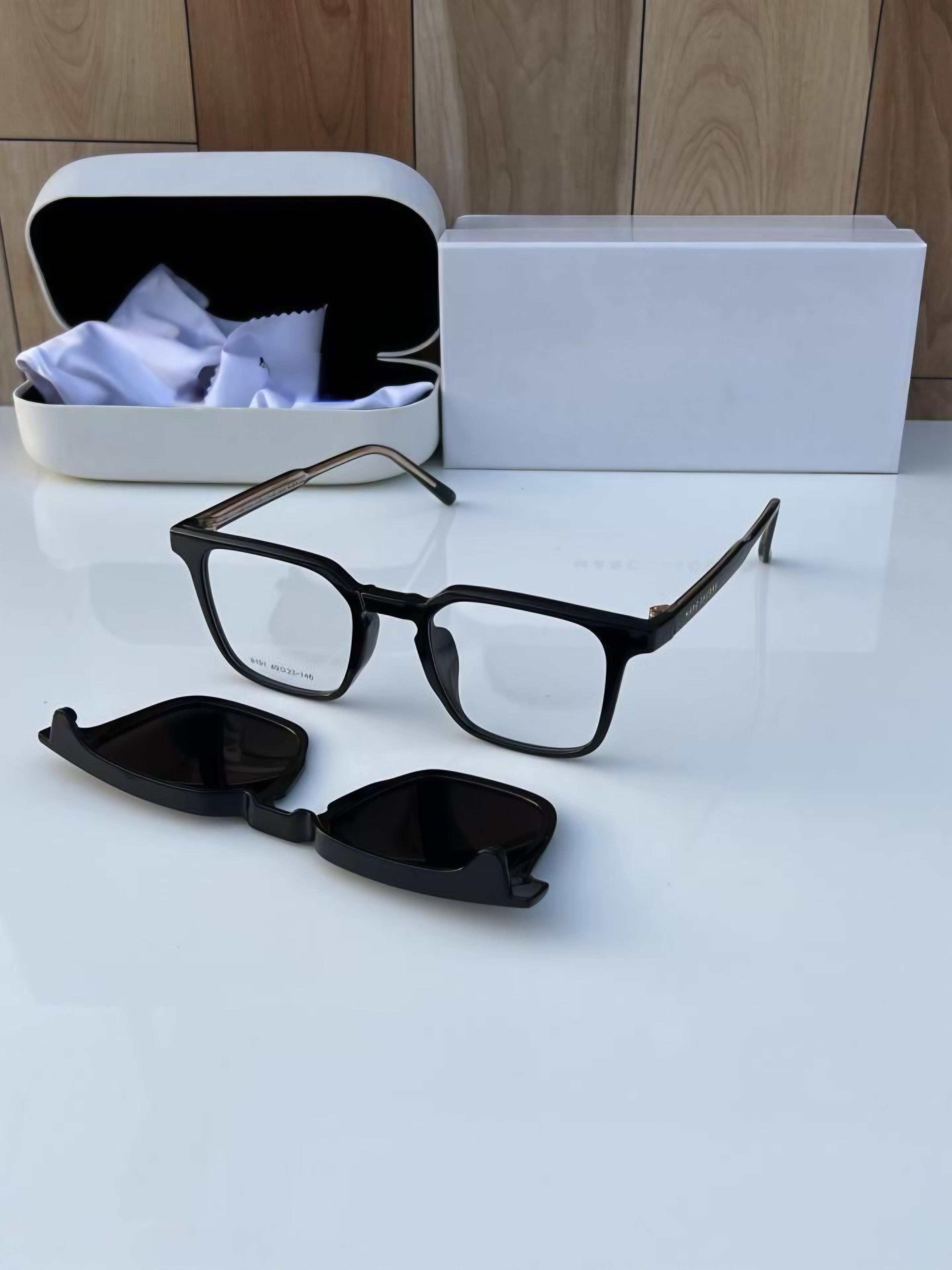 Black Base Frame Glasses next to the detached Magnetic Clip-On Sunglass lens and protective case.