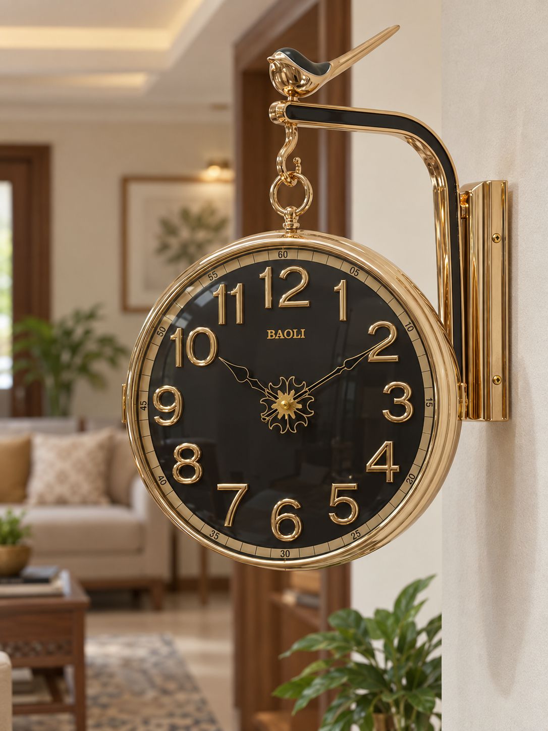 Black dual-sided rotating wall clock with Arabic numeral dial and gold-tone frame