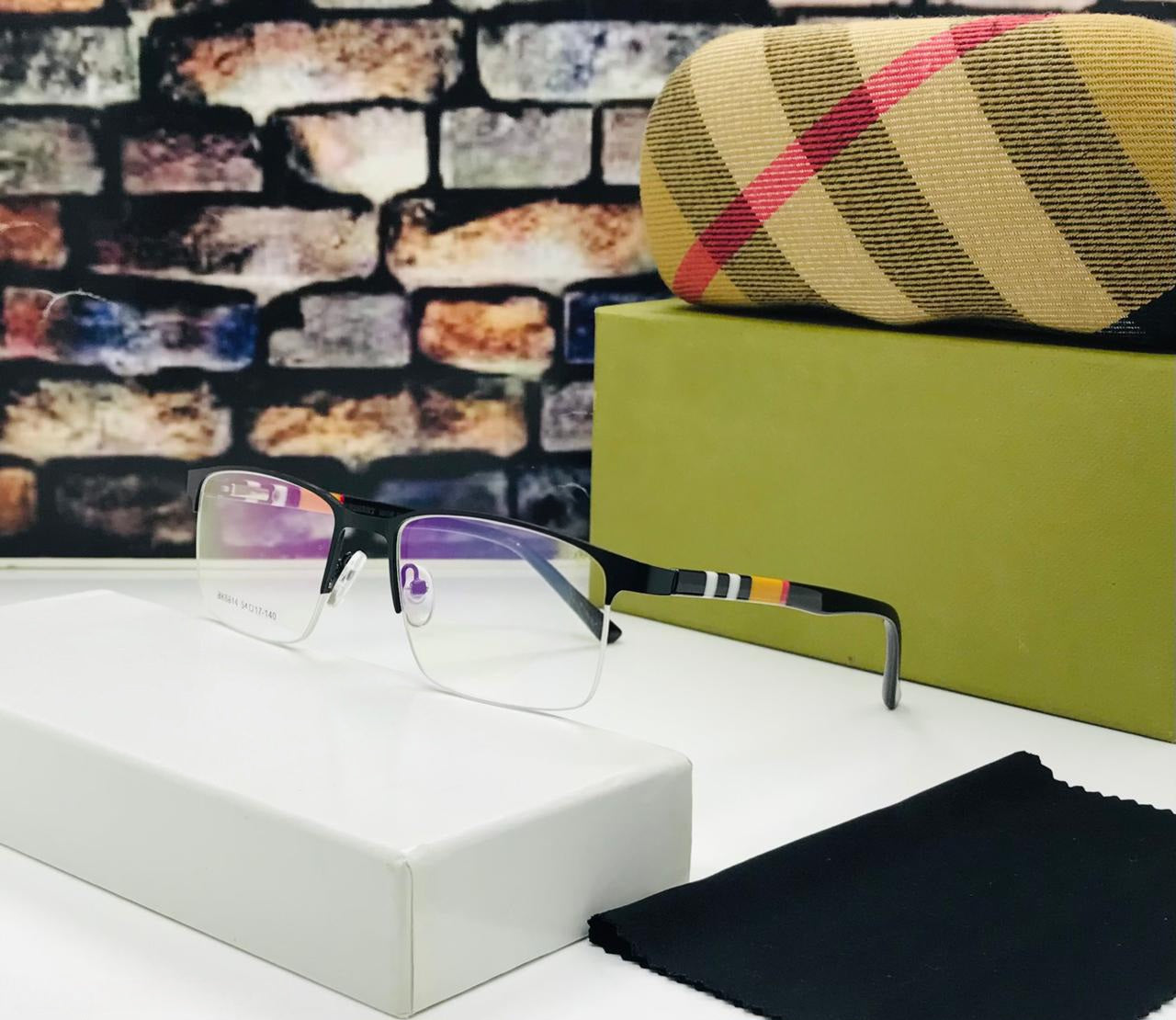 Black metal half-rim rectangular eyeglasses with a multi-coloured stripe detail on the temples.