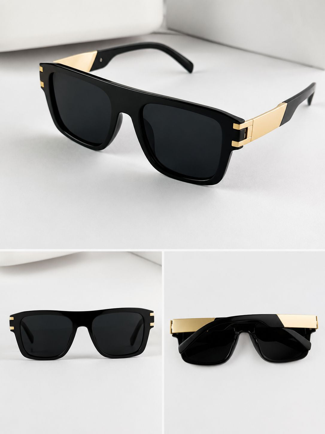 Black sunglasses with gold accents on a white background