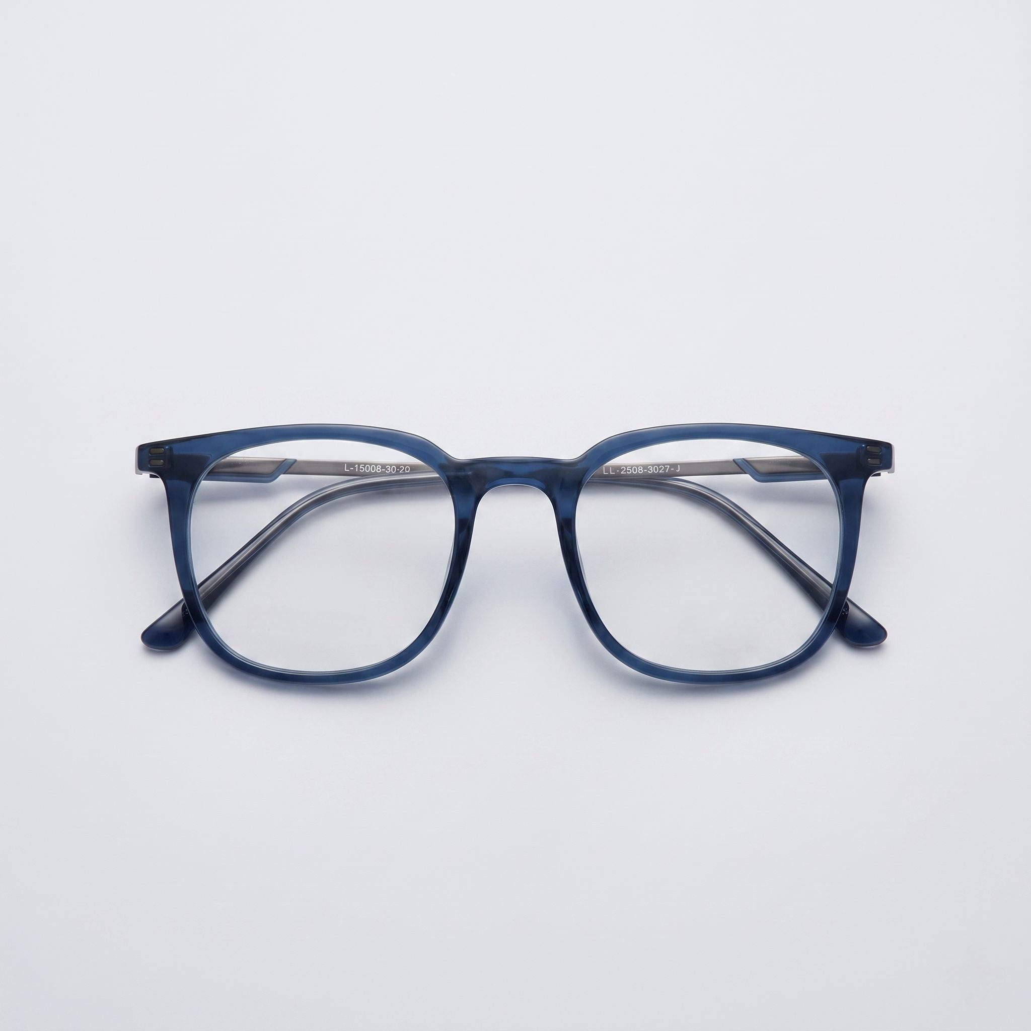 Blue eyeglasses on a light gray background