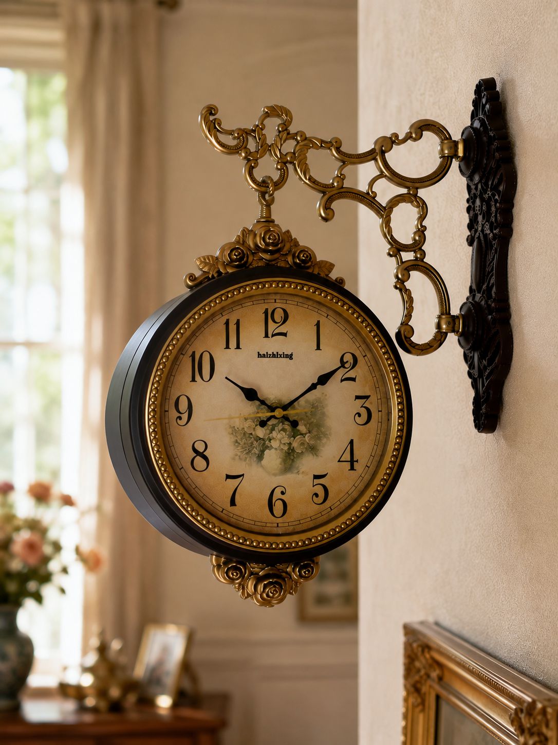 Brown antique wall clock with Arabic numeral face and ornate antique gold decorative bracket