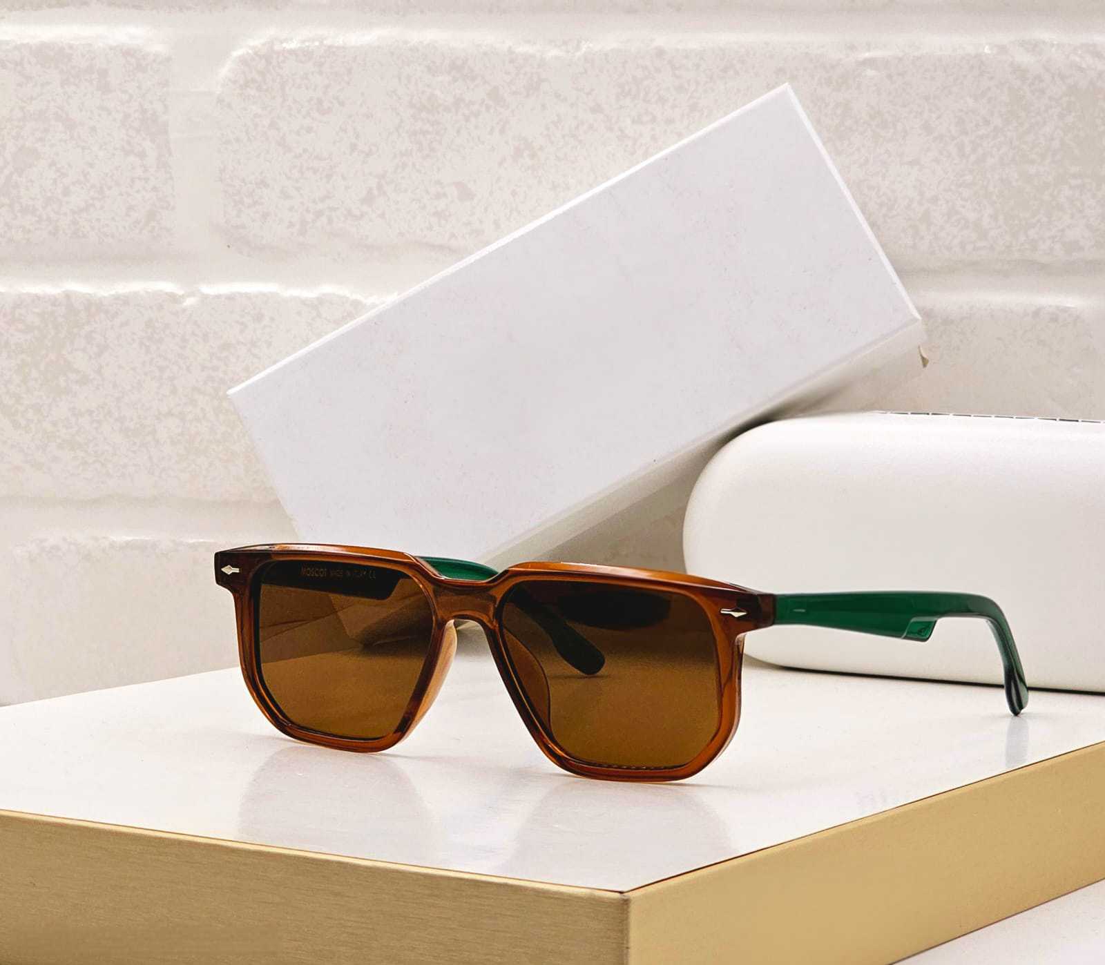 Brown frame rectangular sunglasses with contrasting green temples and brown lenses.