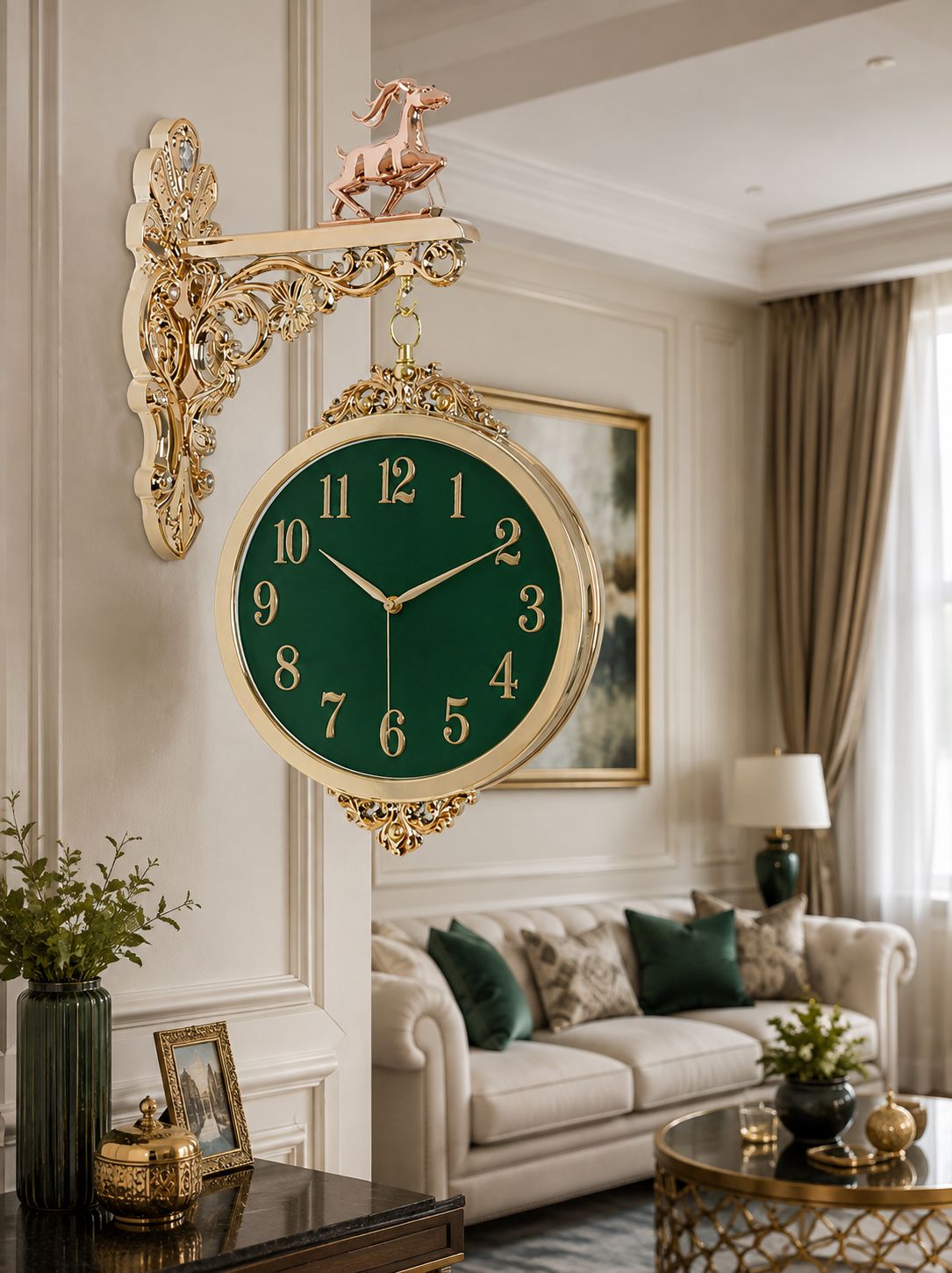 An ornate gold wall-mounted clock with a dark green face and gold numerals, hanging on a cream paneled wall in a styled living room with a sofa, curtains, and side table.