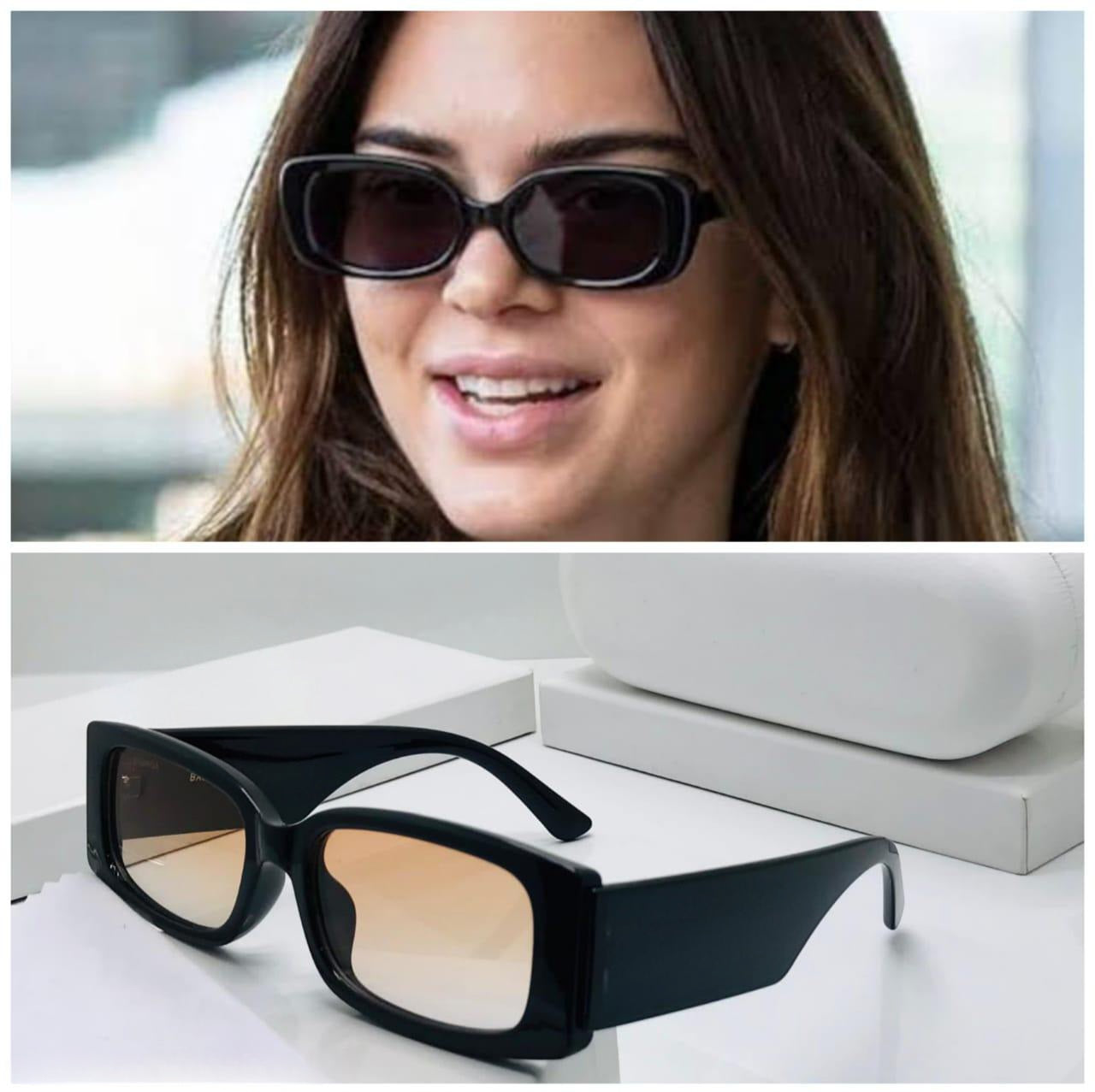 Chunky black rectangular sunglasses with warm orange gradient lenses, next to a picture of Alia Bhatt wearing a similar style.