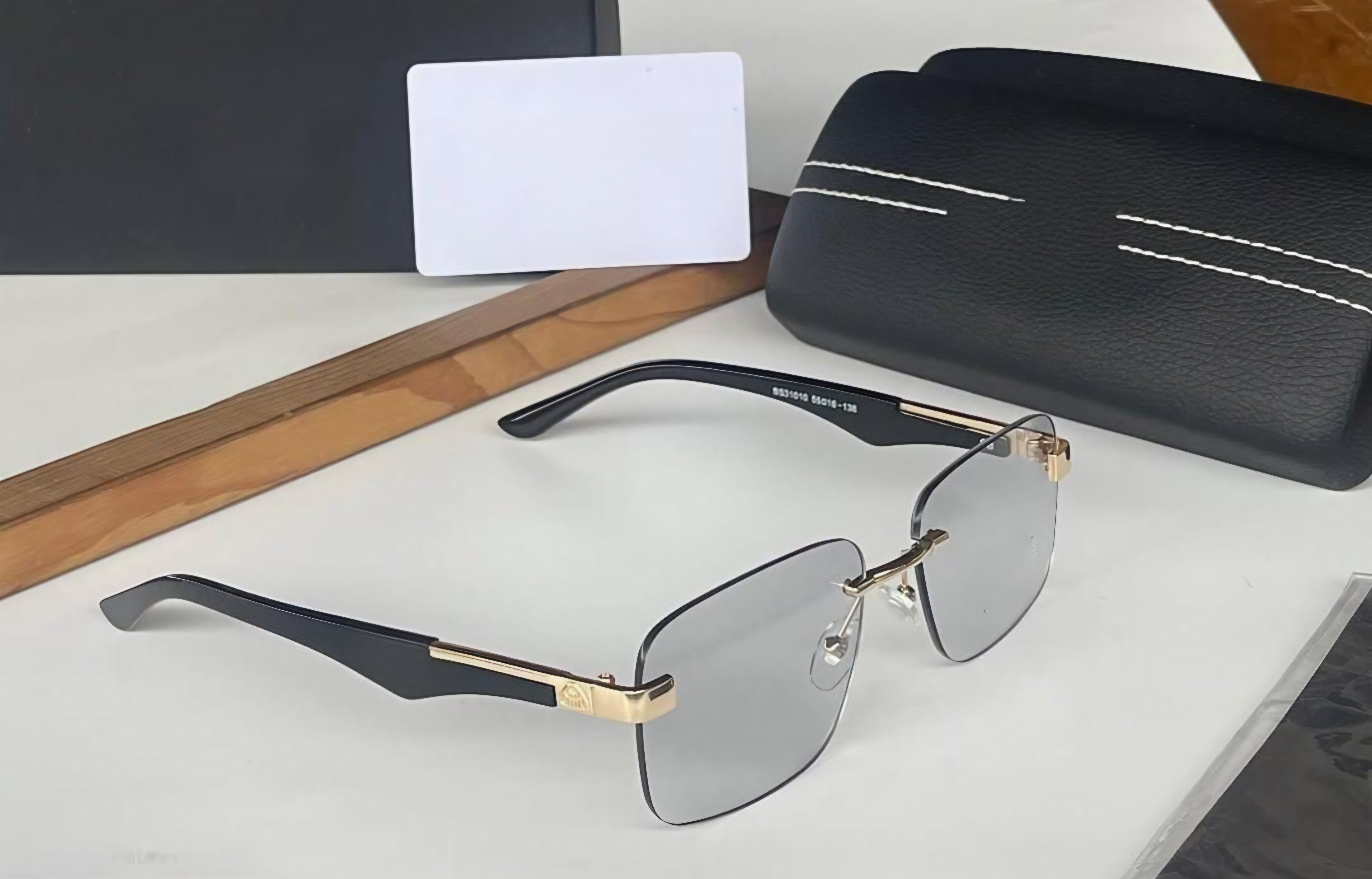 Classic black aviator sunglasses with a Golden metal frame, shown on a neutral background