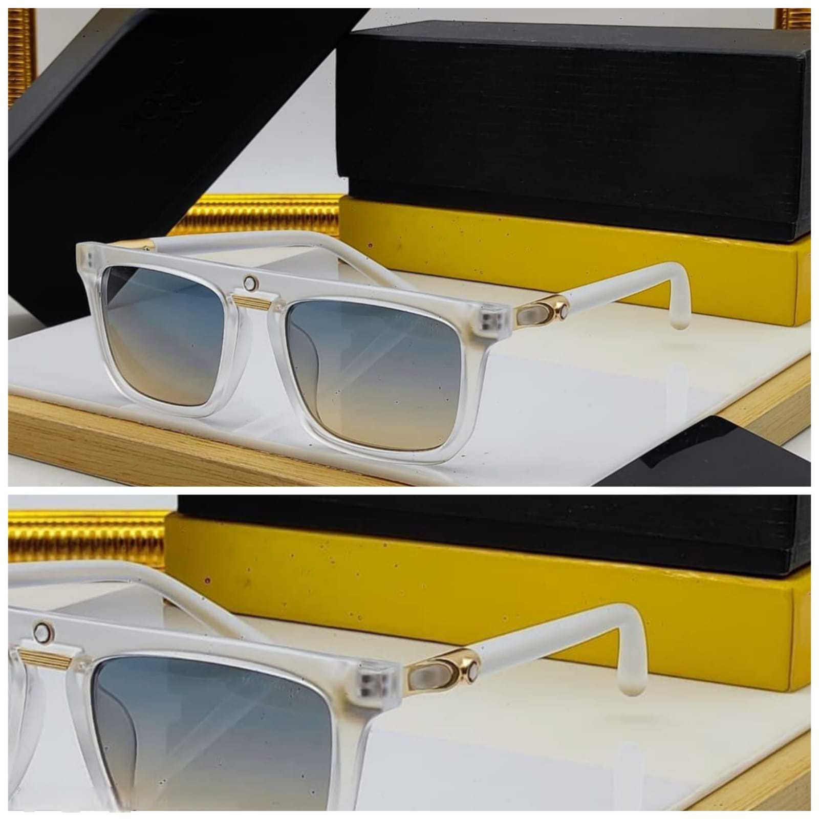 Close-up view of the clear frame rectangular sunglasses showing the gradient lenses and gold metallic temple detail.