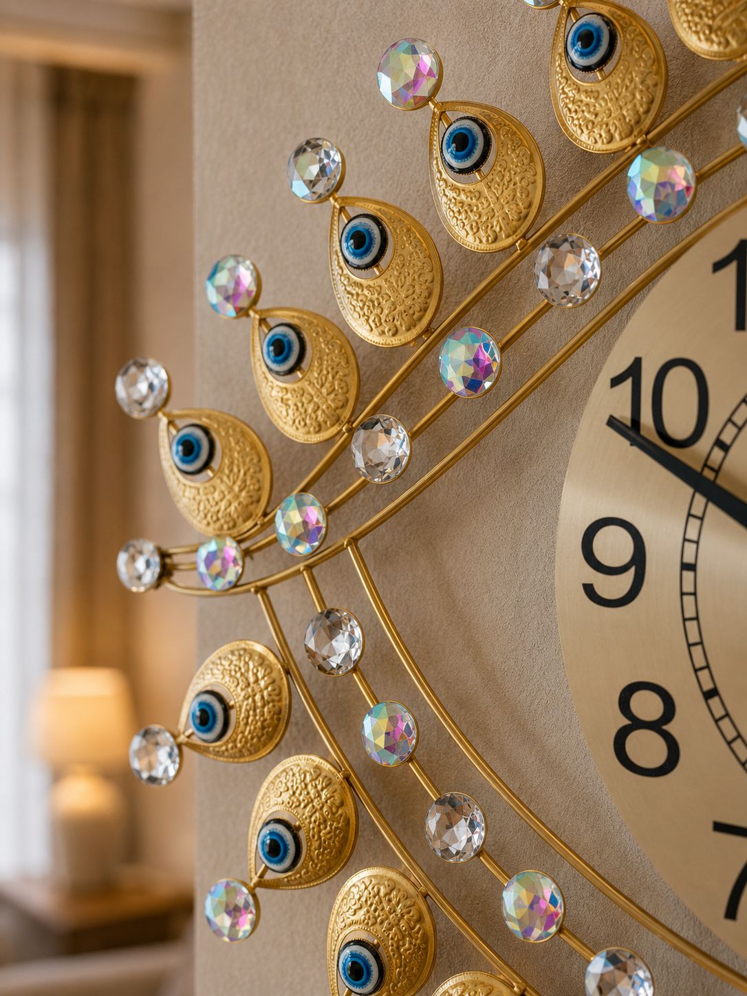 Close-up of Evil Eye inspired metal wall clock showing blue eye details and crystal accents