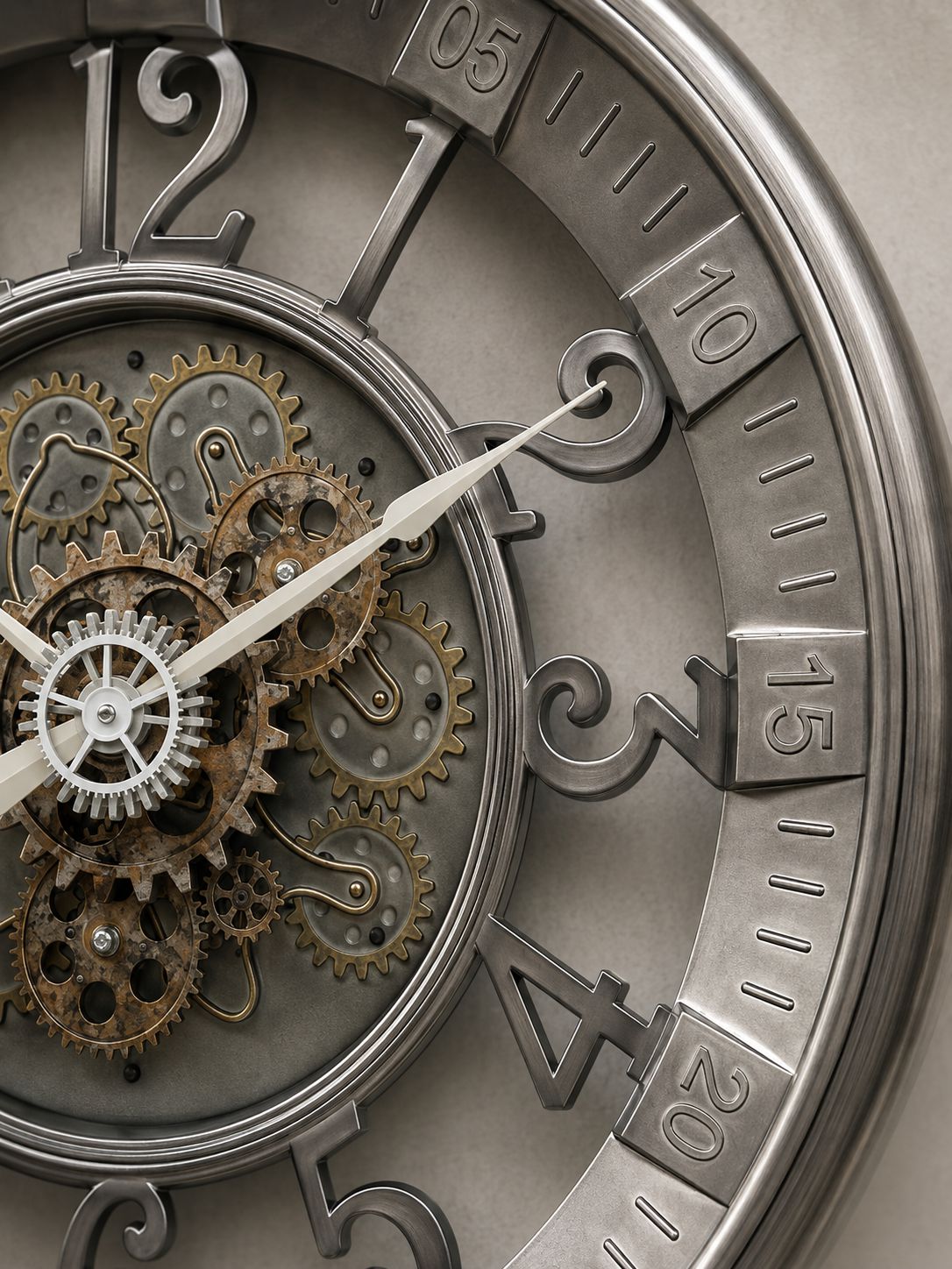 Close-up of a decorative wall clock face with exposed internal gears and cogs, large stylized numerals, and metallic silver and bronze tones.