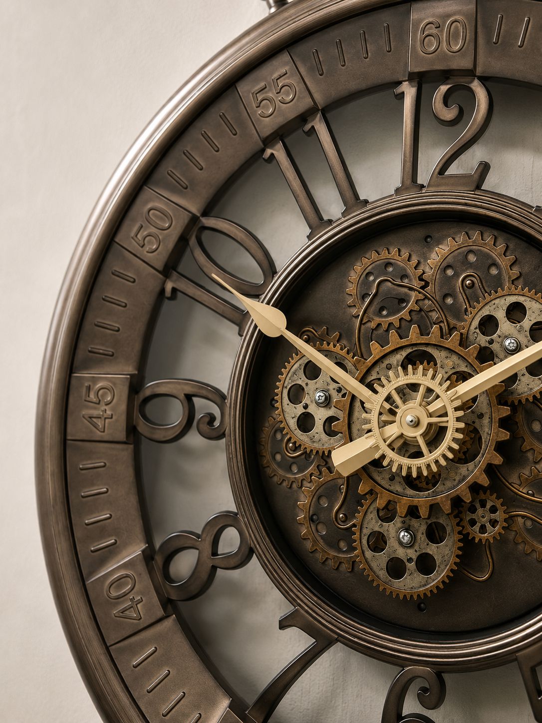 Close-up of a decorative wall clock with a bronze-toned metal frame, large Roman numerals, and a visible inner gear mechanism with brass-colored hands.