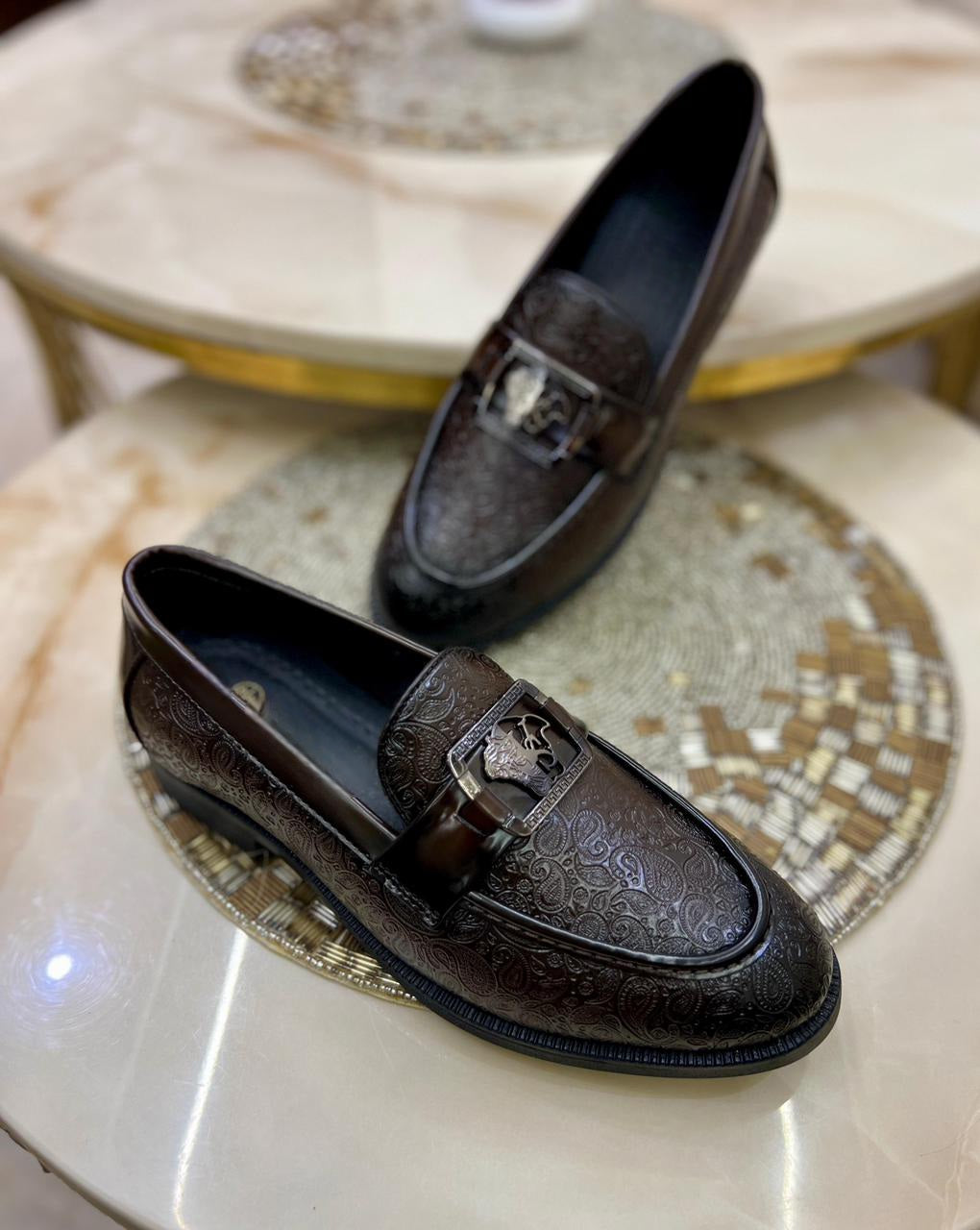 Close-up of a man's feet wearing FunkyTradition Brown loafers, showing the quality of the suede faux leather.