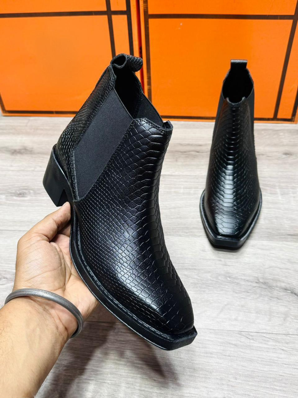 Close-up of black Chelsea boots showing elastic gusset and TPR sole – FunkyTradition