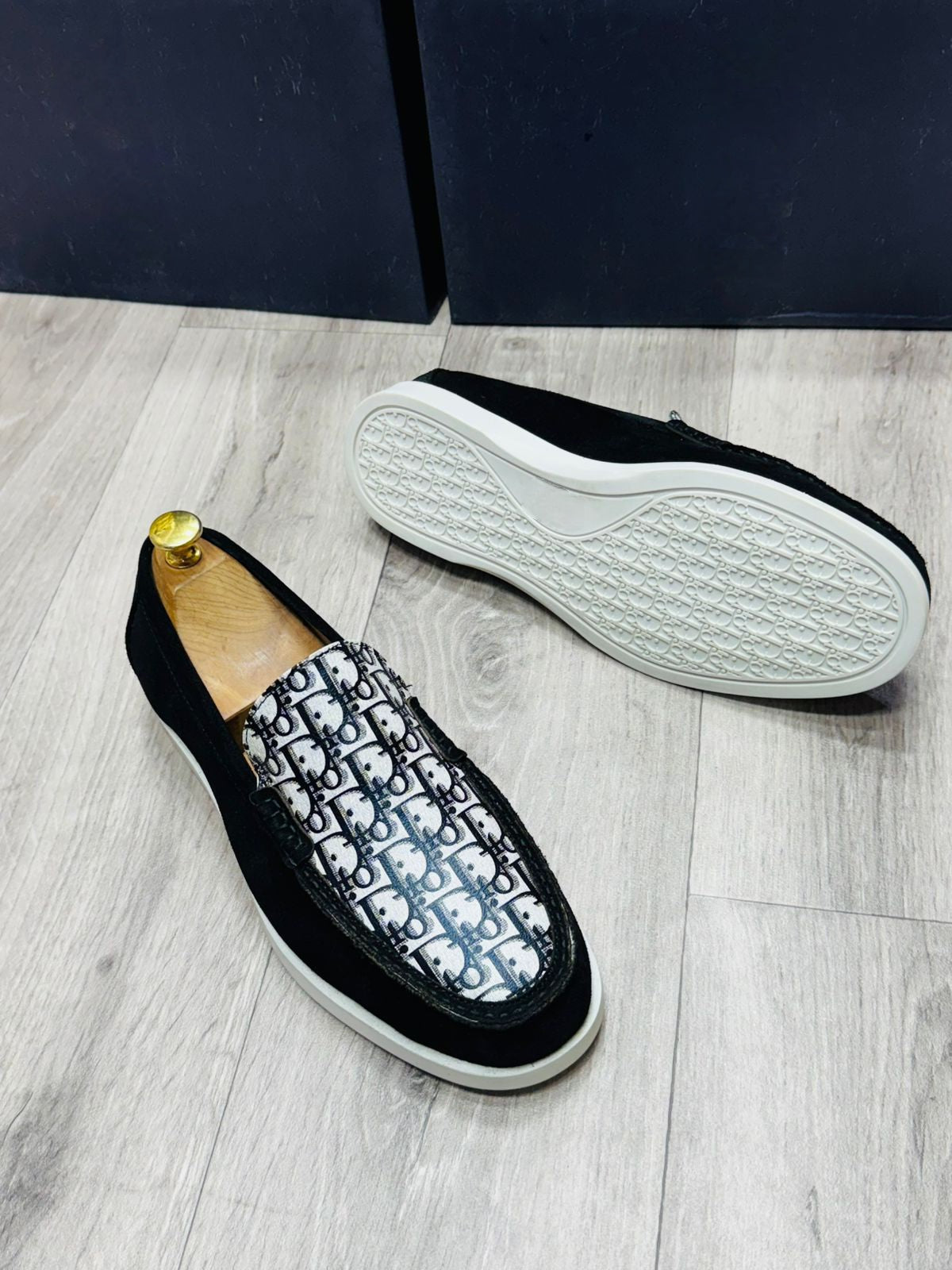 Close-up of comfortable white TPR sole on black designer loafer