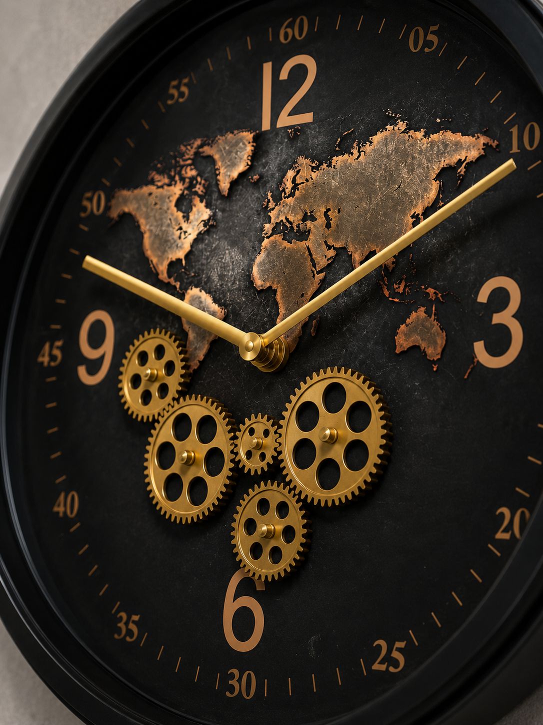 Close-up of decorative gold moving gears and world map design wall clock