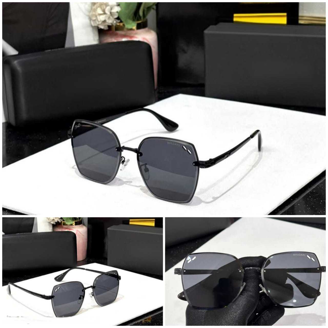 Close-up of the black hexagonal sunglasses showing the metal detail on the frame and the quality of the lenses