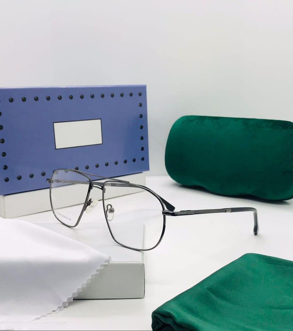 Close-up of the lightweight gunmetal metal eyeglasses showing the textured pattern on the temple arm.