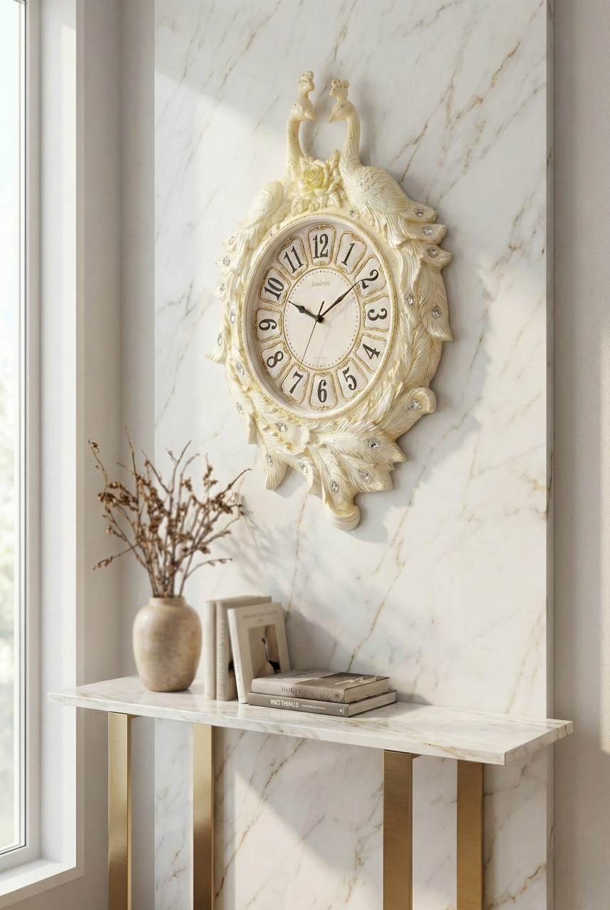 Decorative wall clock on a marble wall with a small table and vase below.