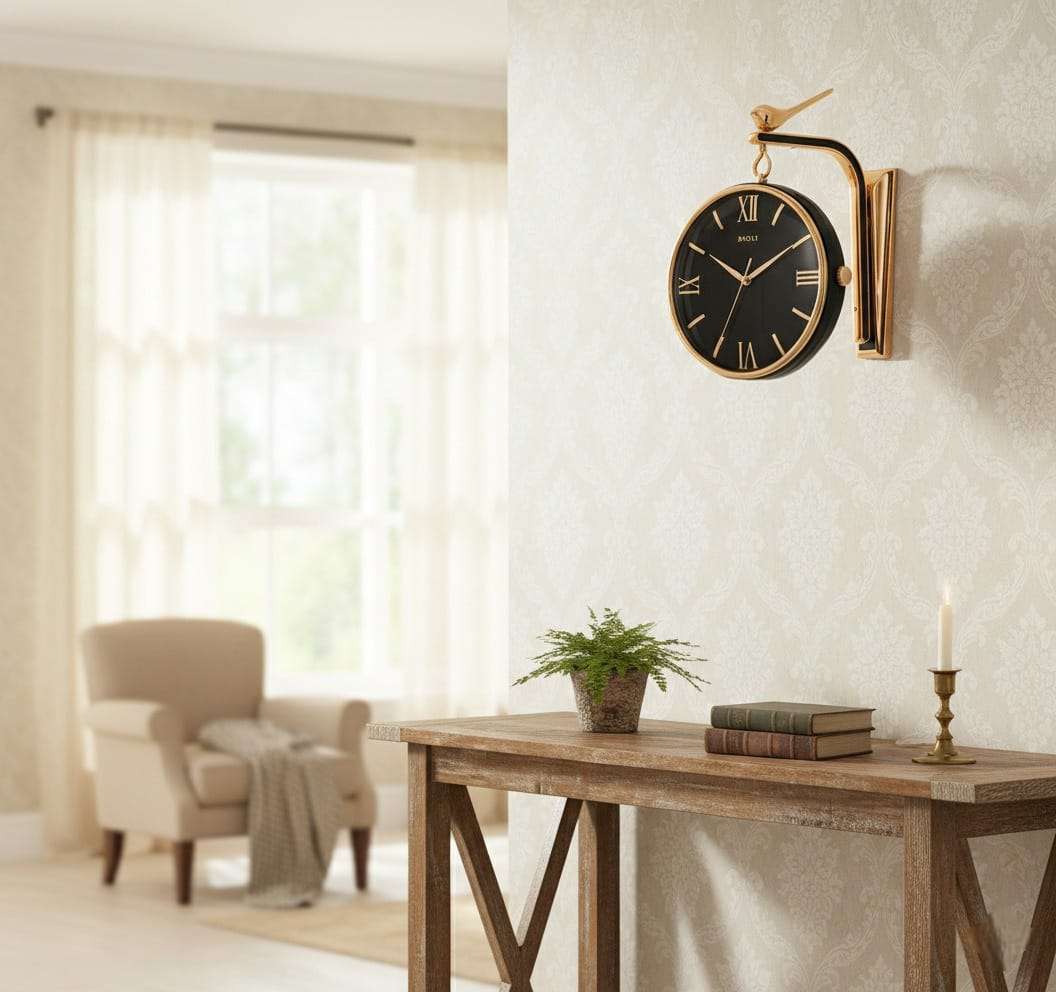 Decorative wall clock on a white wall above a wooden table with a plant and books.