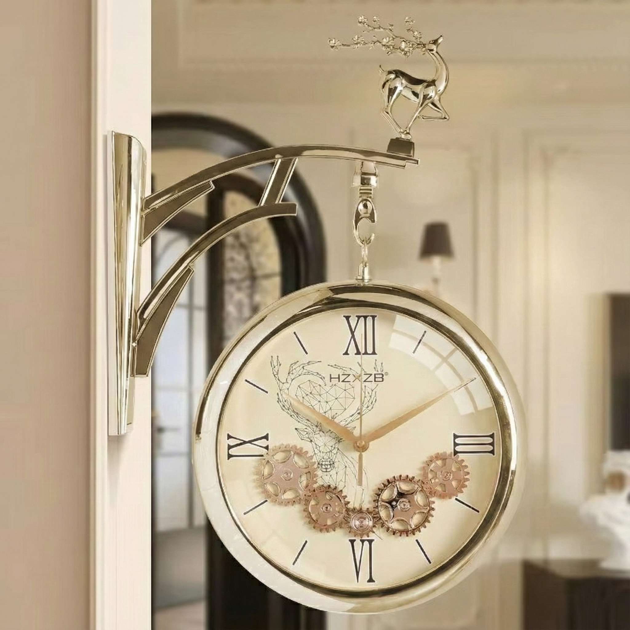 Decorative wall clock with gear design and deer figurine on a blurred background