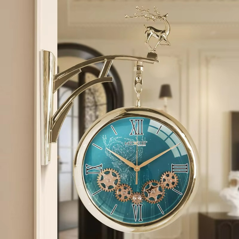 Decorative wall clock with teal face and gold accents in a home setting
