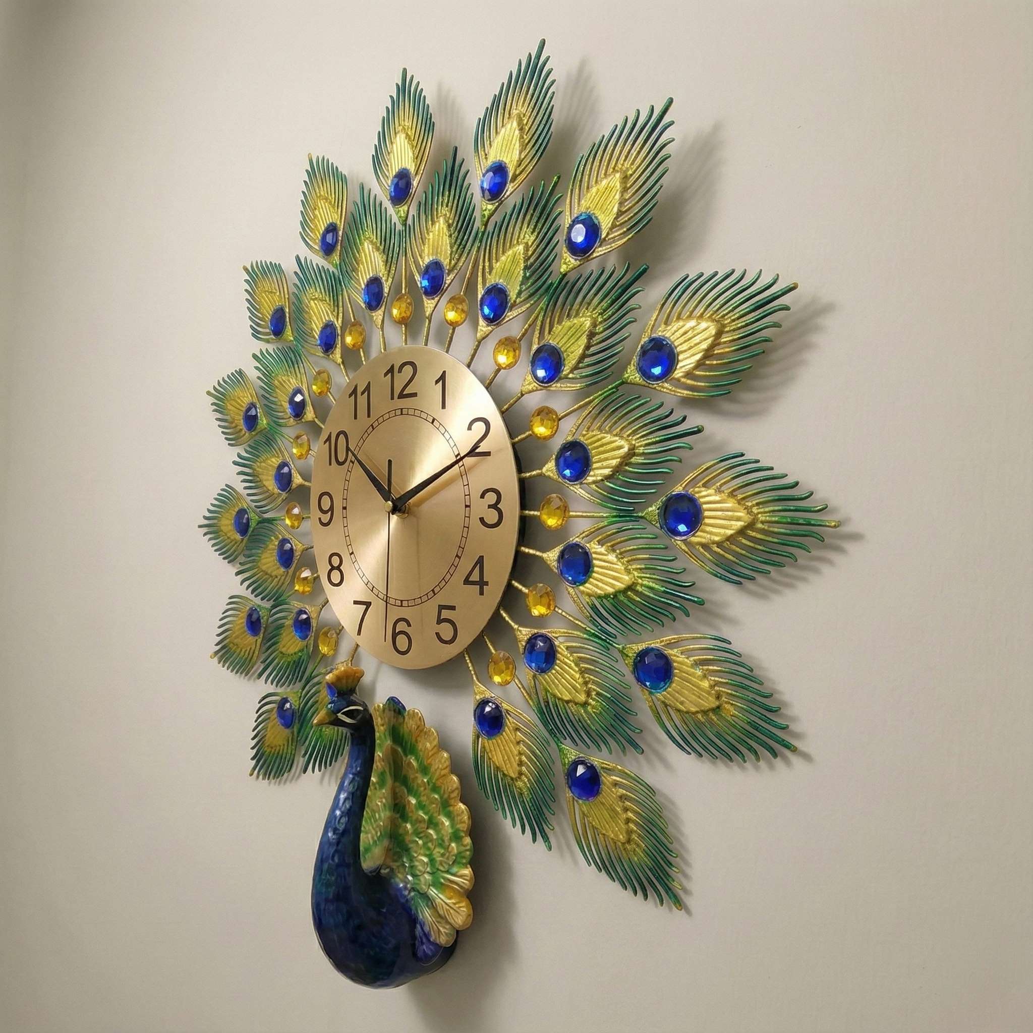 Decorative wall clock with peacock feather design on a plain background