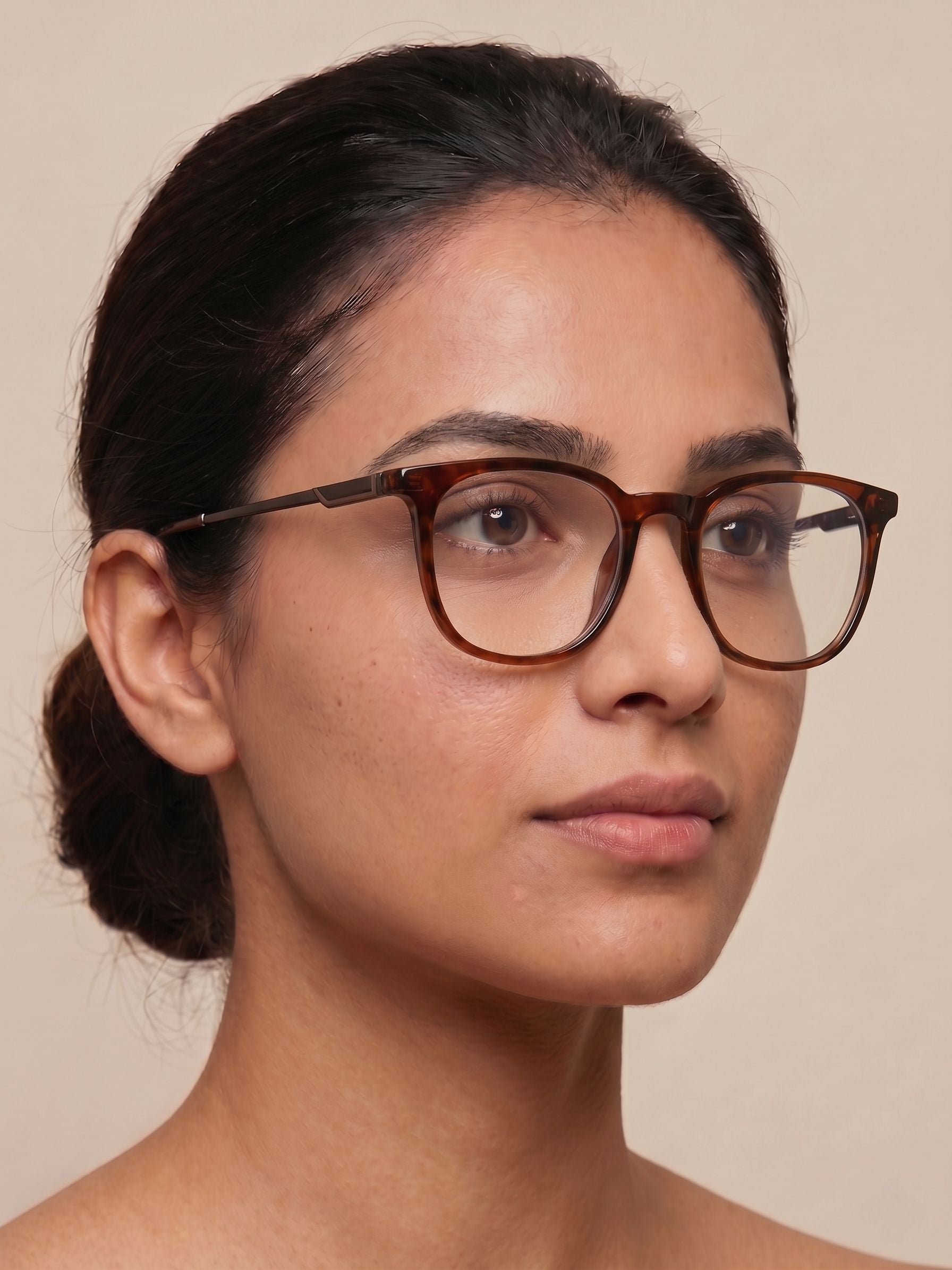 Female model wearing brown transparent square eyeglasses