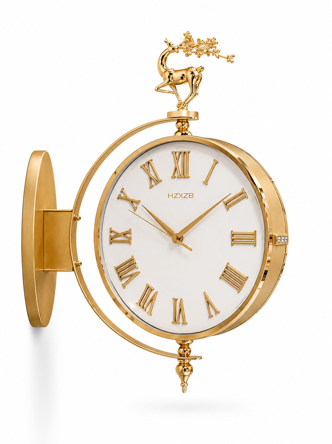 Gold wall clock with a white dial, Roman numerals, a deer finial, and a circular side mount, shown on a white background.