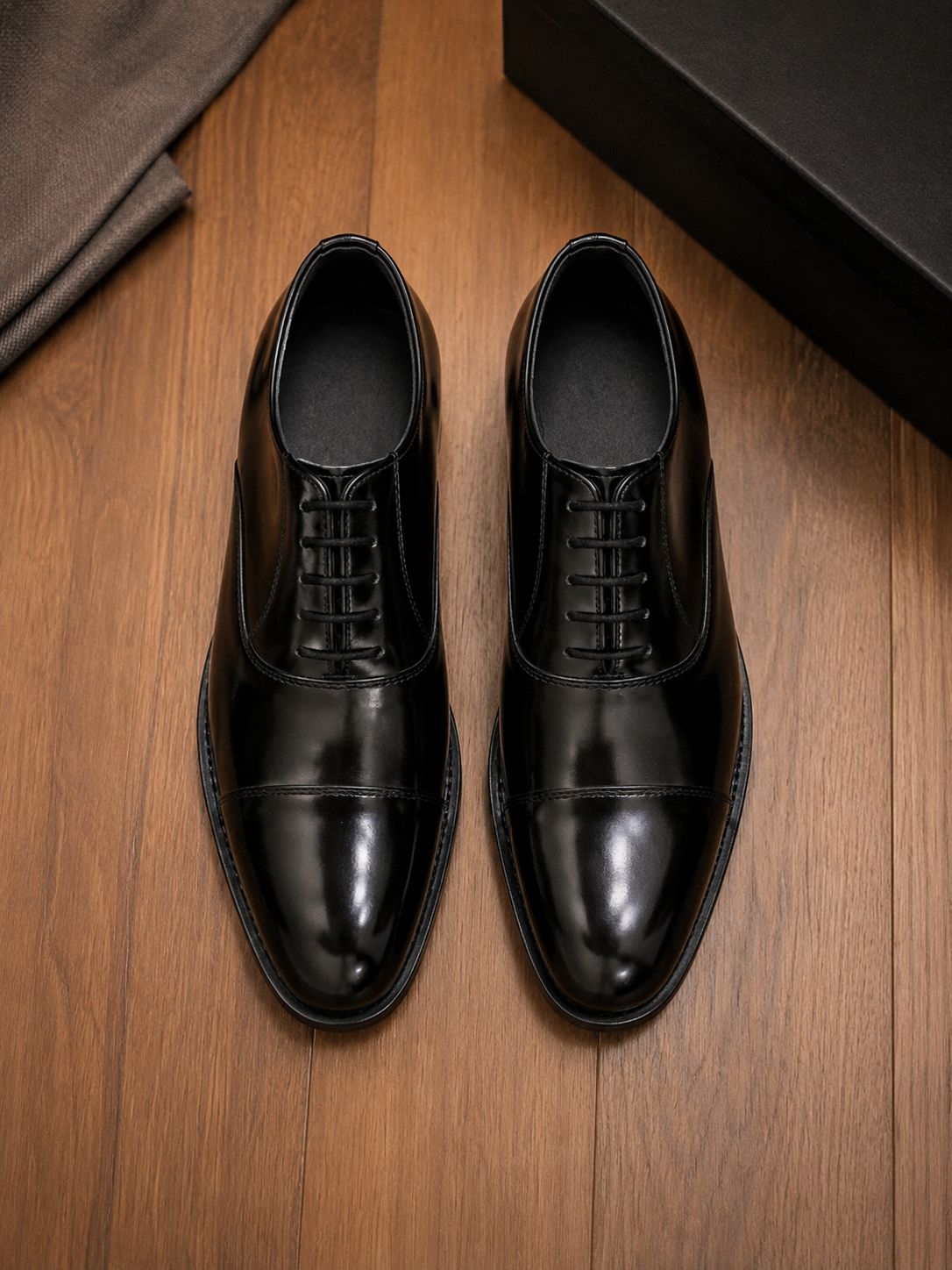 High-shine luxury Oxford shoes top view product photography