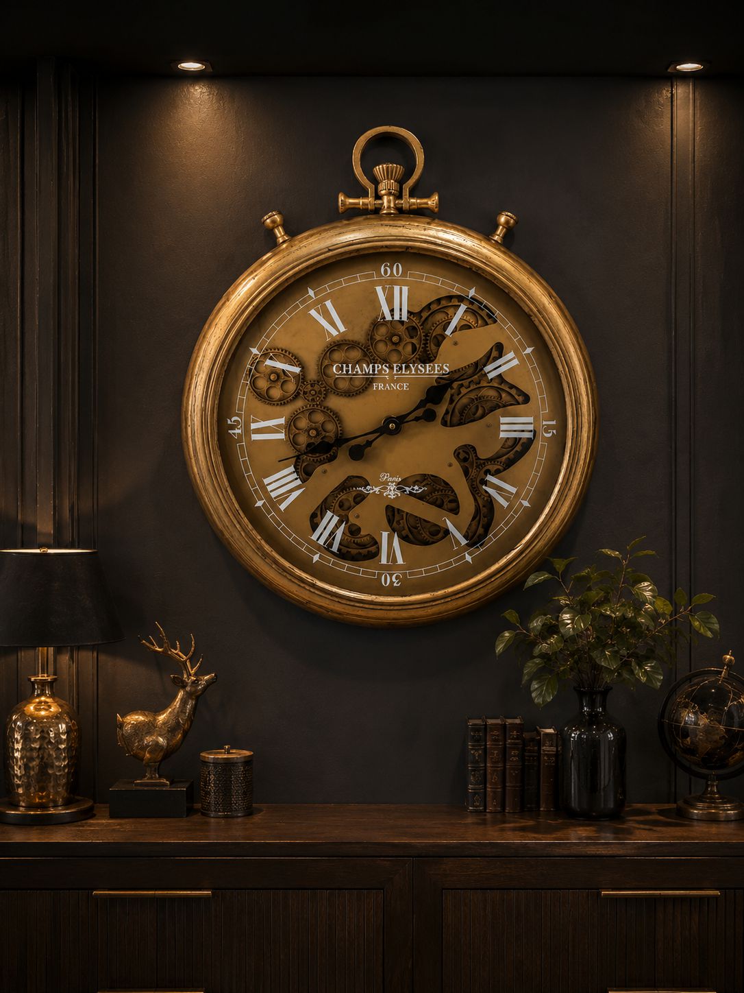 Large ornate clock on a dark wall with decorative items below