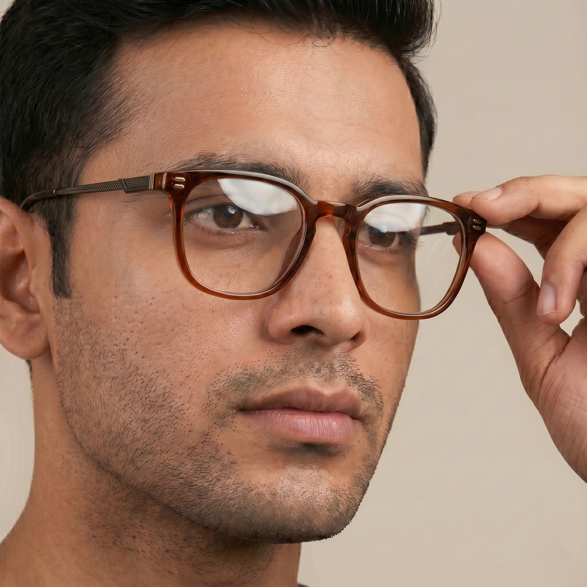 Male model wearing premium brown optical frame