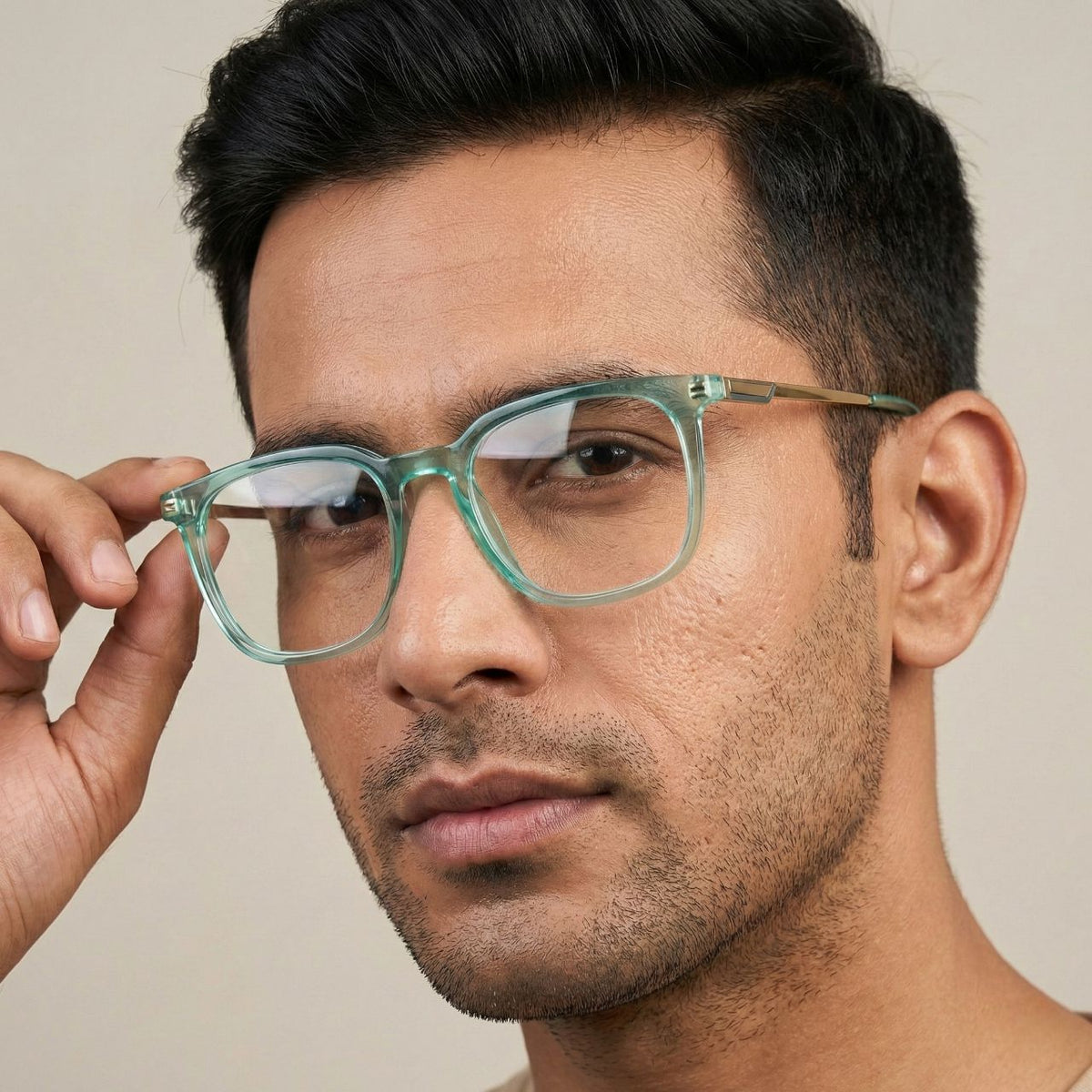 Male model wearing transparent mint green square eyeglasses