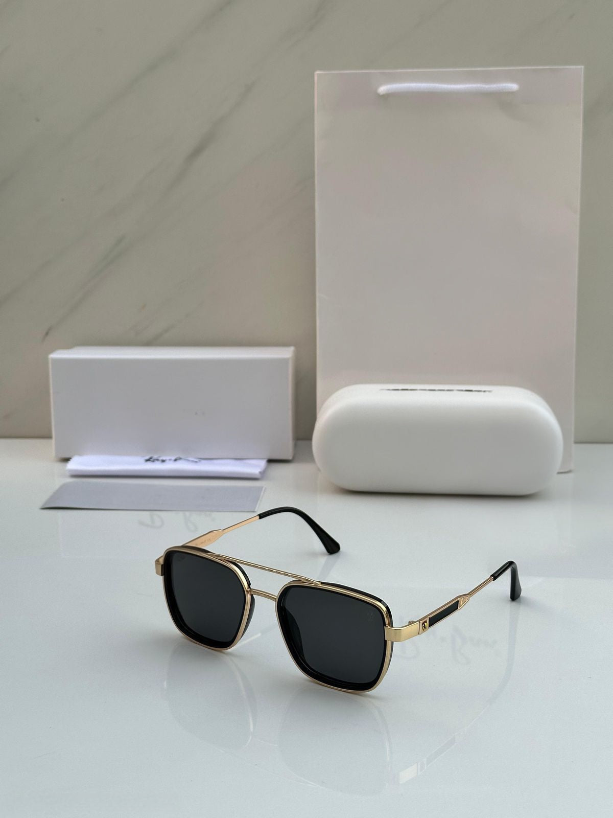 Men’s luxury gold metal frame black lens sunglasses front view