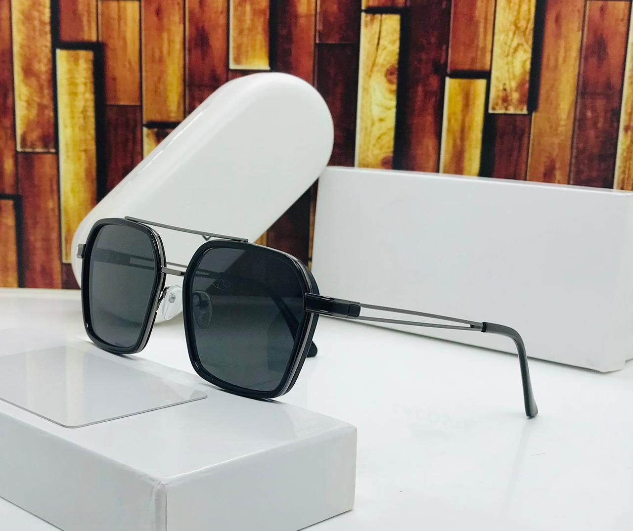 Men's square aviator sunglasses in full black metal frame with dark lenses and white case.