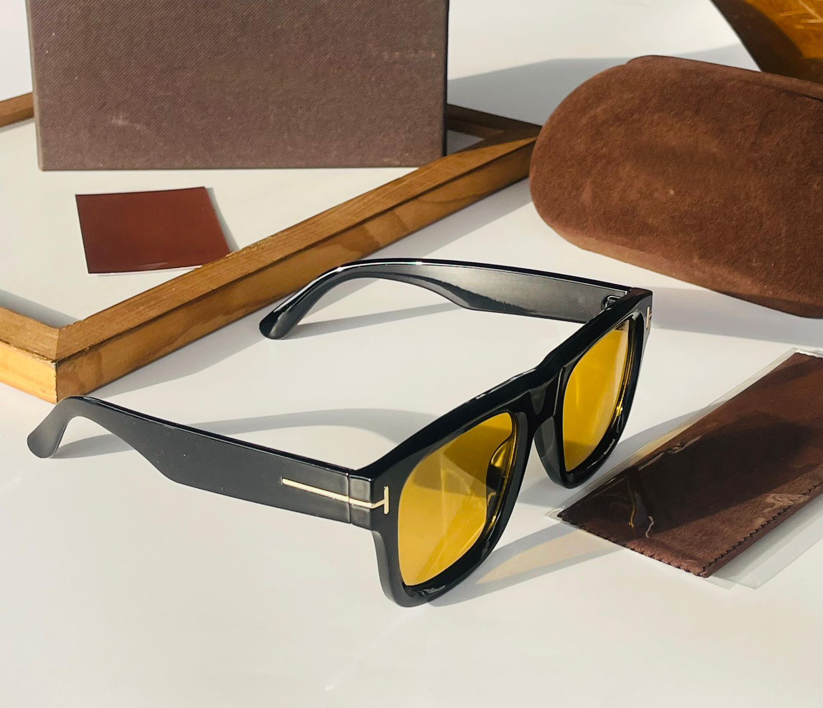 Premium glossy black sunglasses with yellow lenses