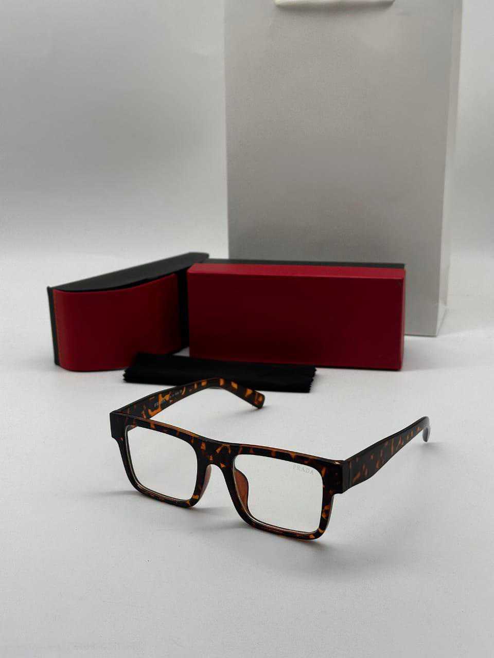 Premium tortoiseshell rectangle sunglasses with gold 'T' temple accents, displayed with a case.