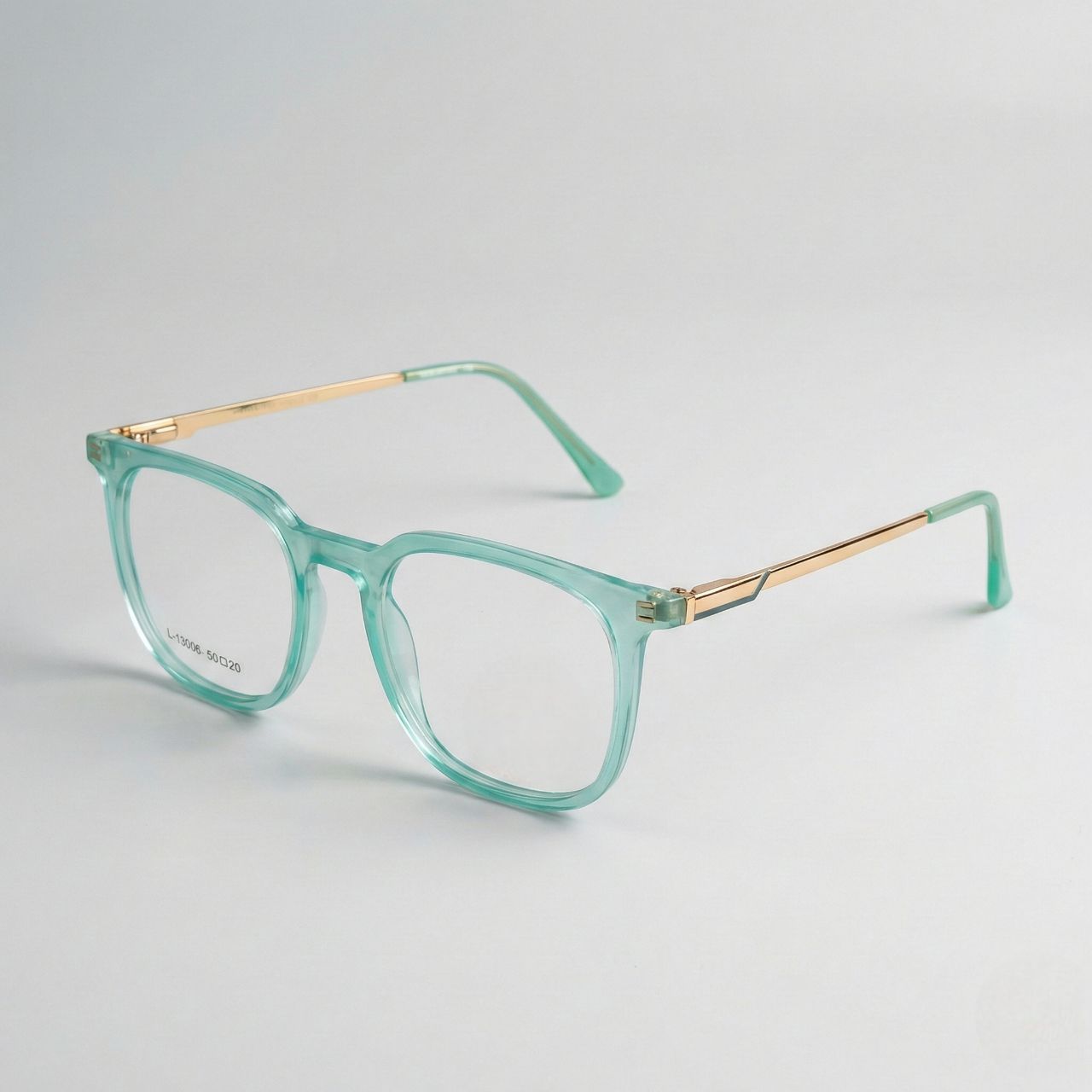 Premium transparent mint green eyeglass frame isolated product photography