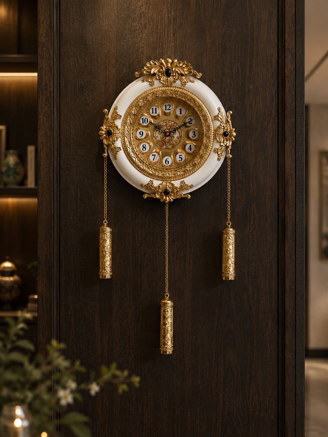 Royal white and gold decorative wall clock with hanging weights in luxury living room