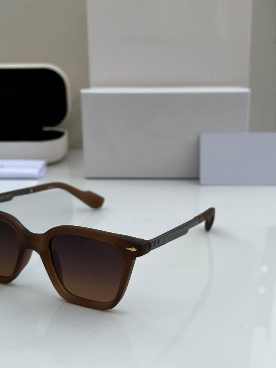 Side angle view of brown square sunglasses with gradient lenses