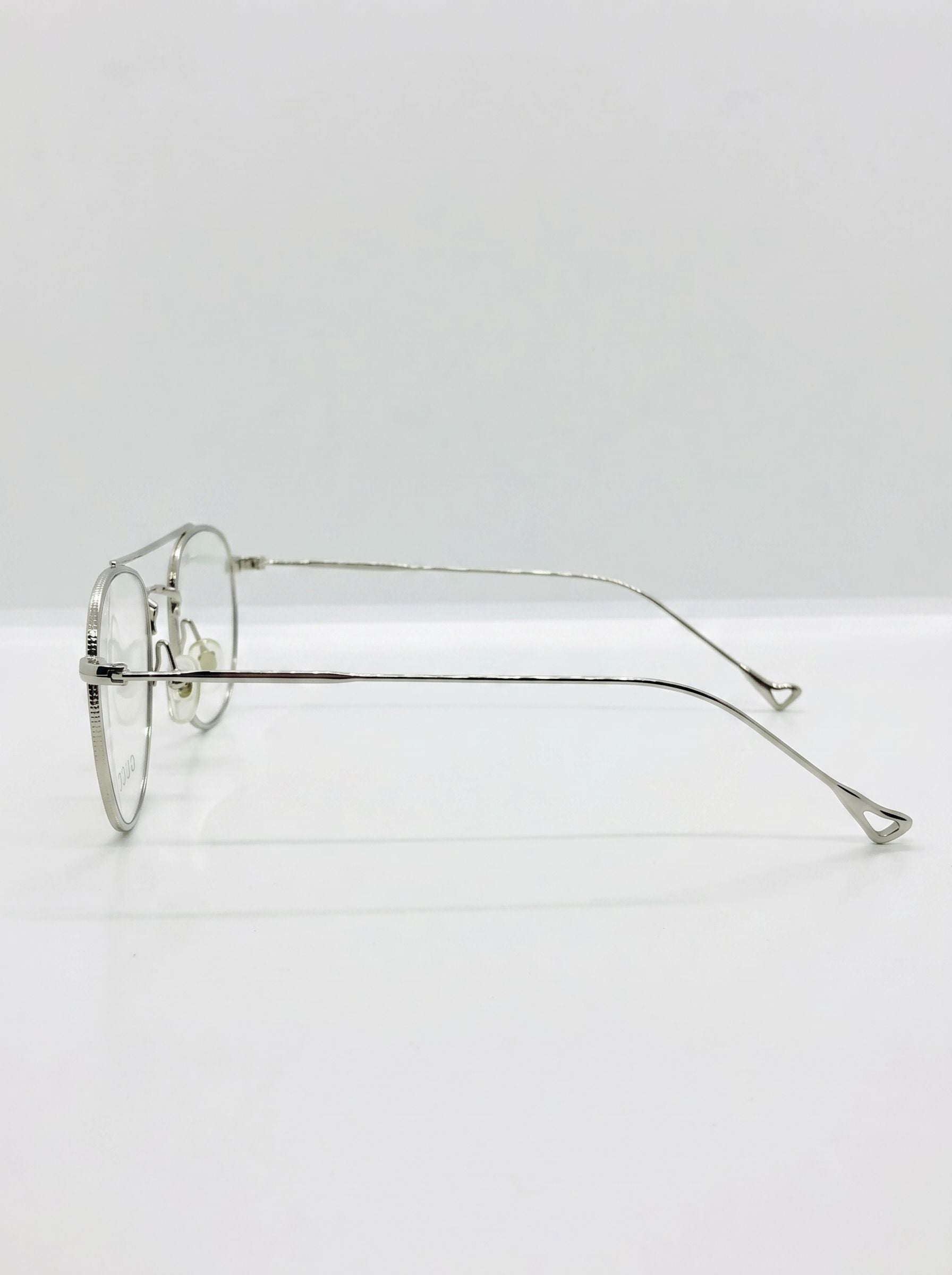 Side profile shot of lightweight silver stainless steel eyeglasses frame