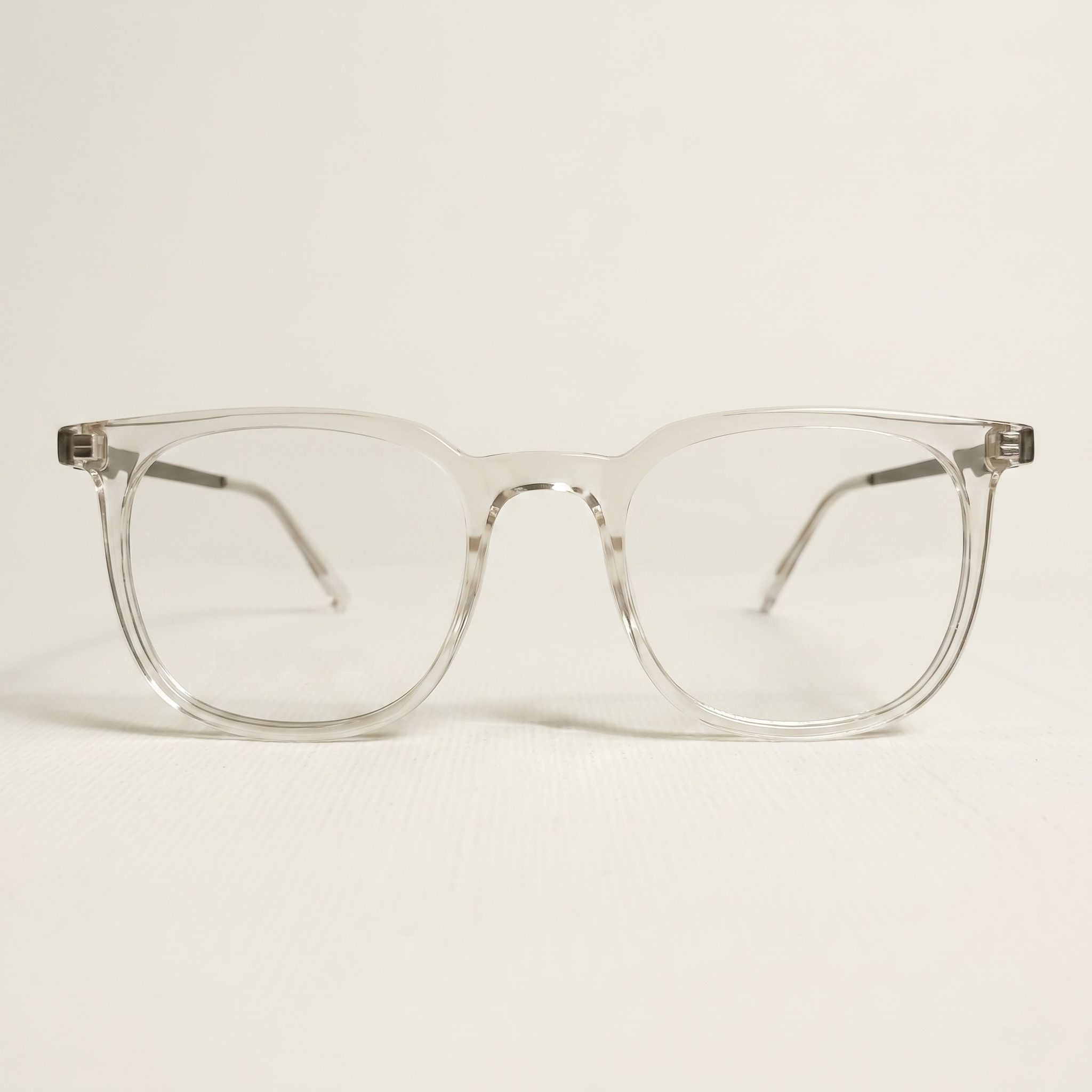 Transparent eyeglasses showcasing premium frame and metal temple construction