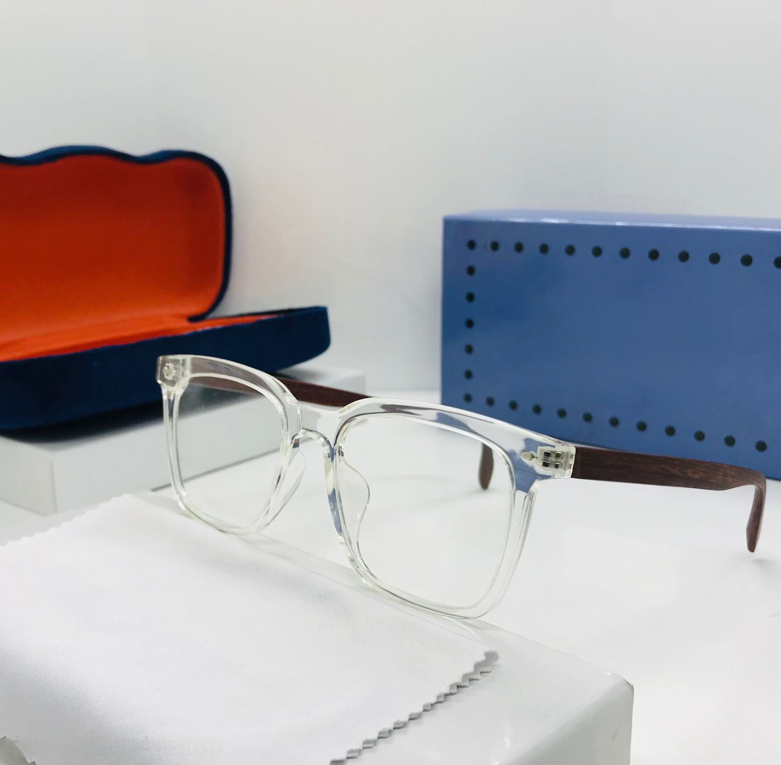 Trending clear transparent eyeglasses with silver temples and sparkling diamond/gemstone detail on the outer corners.