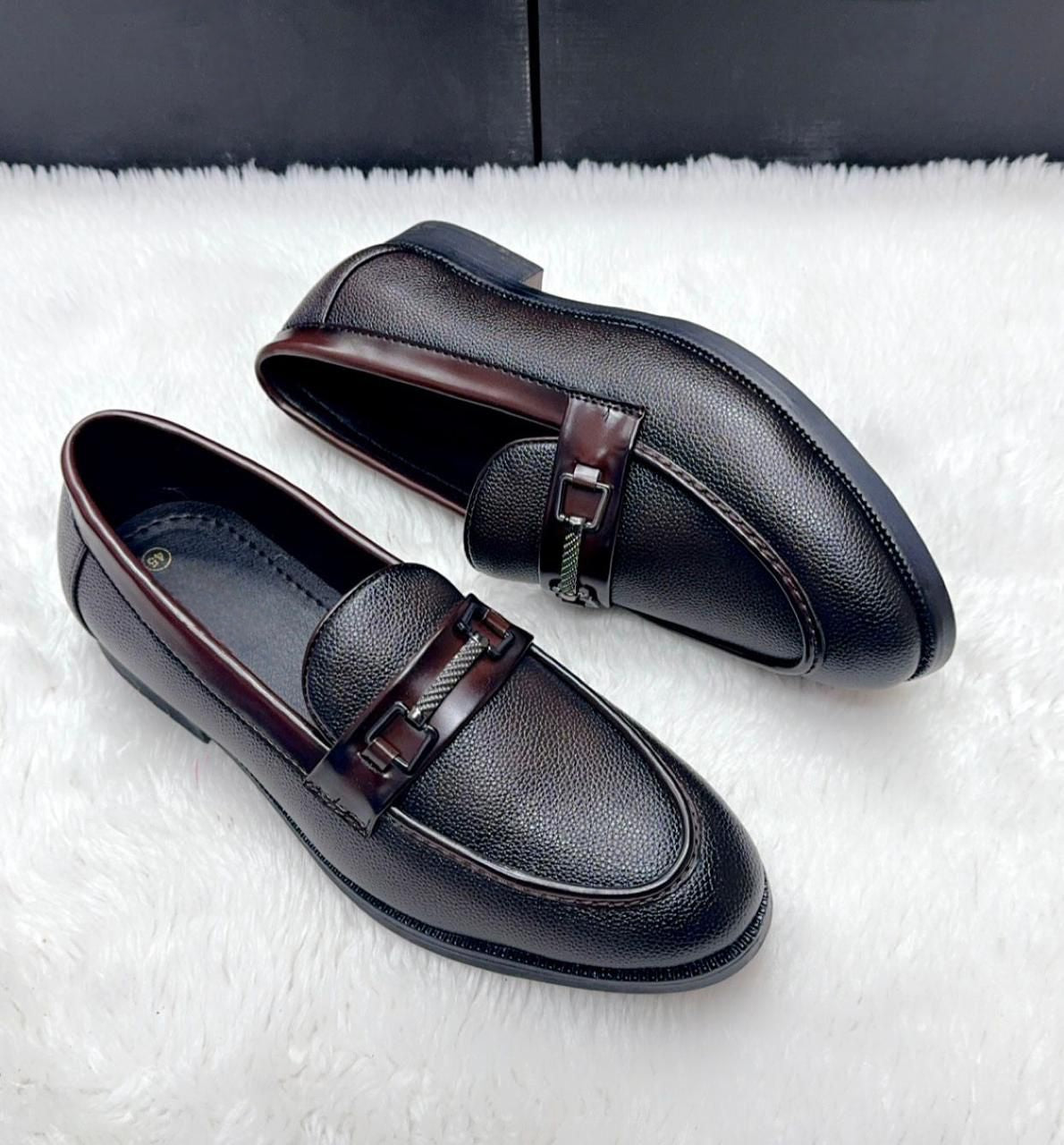 View of the durable Brown TPR sole of the men's loafer shoe.